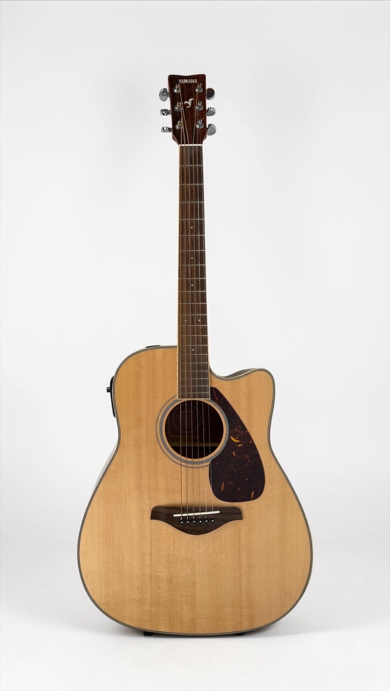 2005 Yamaha FGX 720 CSA Acoustic-Electric Guitar: Color: Natural Serial Number: Q00041048 Case: Hard Case Dimensions: 41" Condition: Light wear and tear to the guitar, consistent with gentle use. The case has light