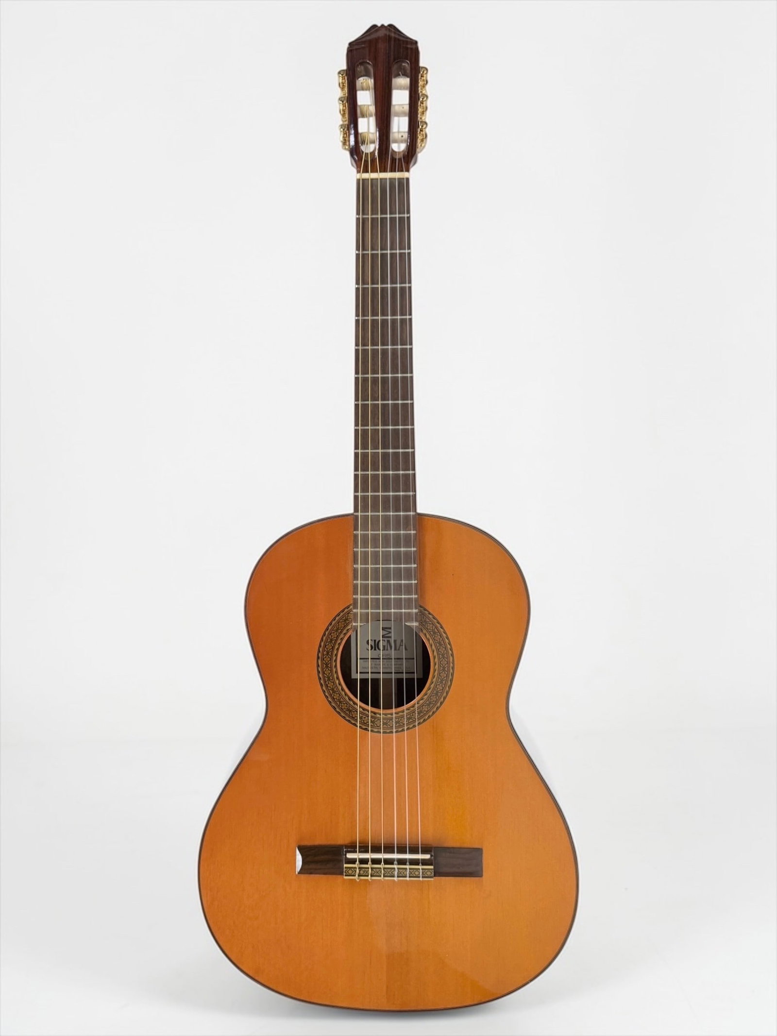 Sigma CR-5 Classic Guitar: Color: Natural Serial Number: Not Available Case: Soft Case Dimensions: Guitar: 40" Long Case: 42" Long Condition: The guitar has light wear, but is overall in