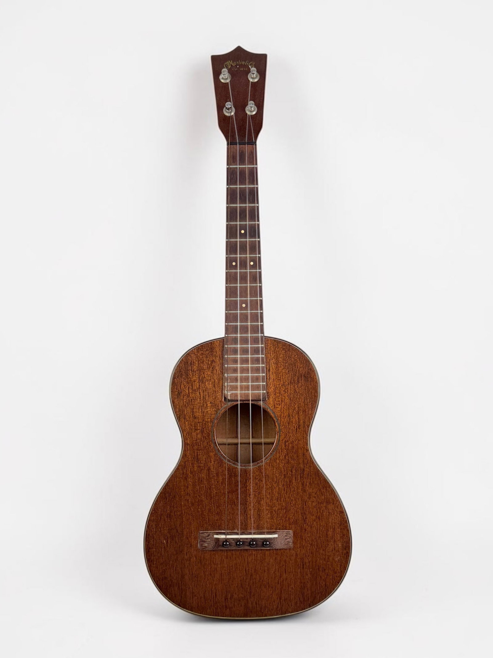 Vintage CF Martin Co Tenor Ukulele: Serial Number: N/A Dimensions: 26" Long Condition: The ukulele is in good condition. The strings should be replaced. Comes with a hard case. 