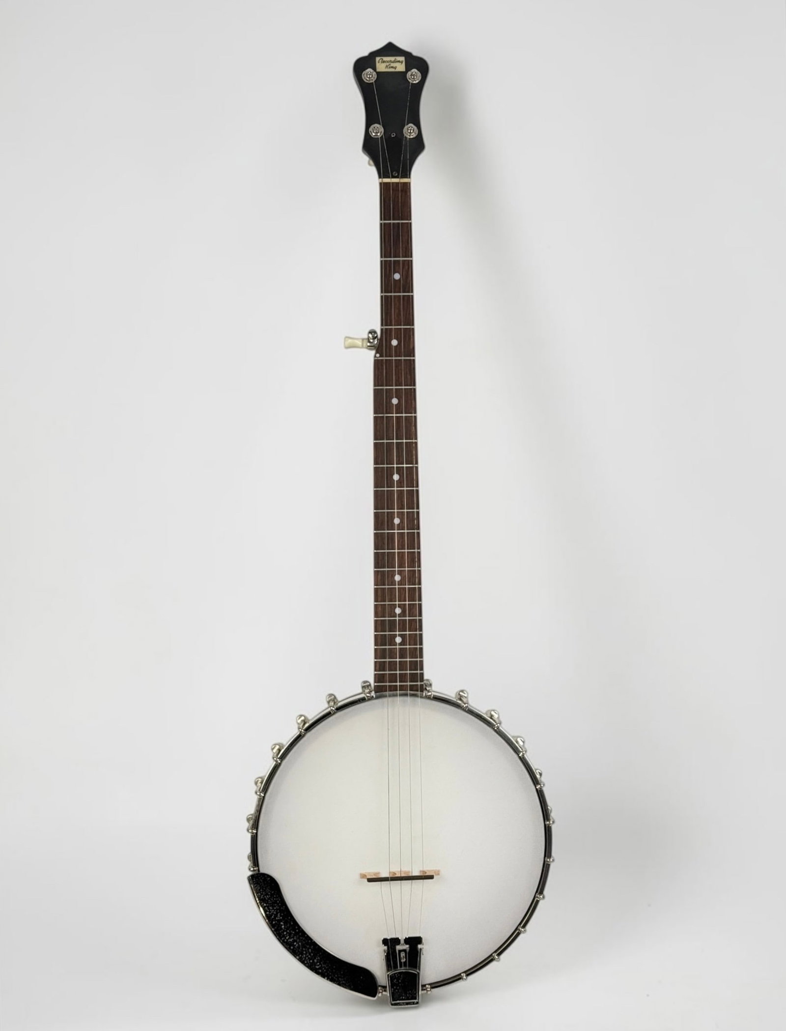 Recording King 5-String Open-Back Banjo: Serial Number: N/A Dimensions: 37" Long Condition: One string is broken; the others will need to be replaced. Otherwise, the banjo is in good condition. 