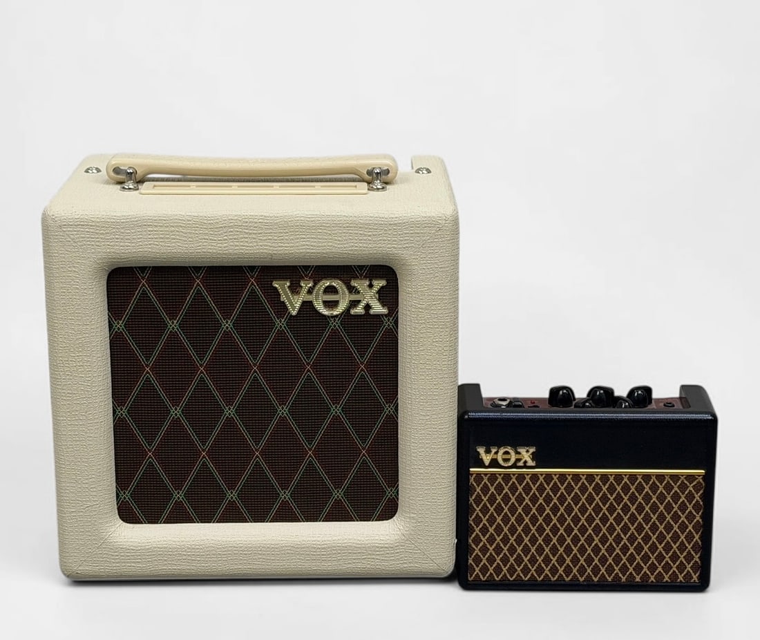 (2) Vox Mini Amplifiers: Lot Includes: VOX AC4TV8 4-watt tube guitar amplifier combo VOX AC1 RhythmVOX Mini Guitar Amplifier Dimensions: 10 1/4" x 10" x 6 3/4" Largest Amp Condition: General