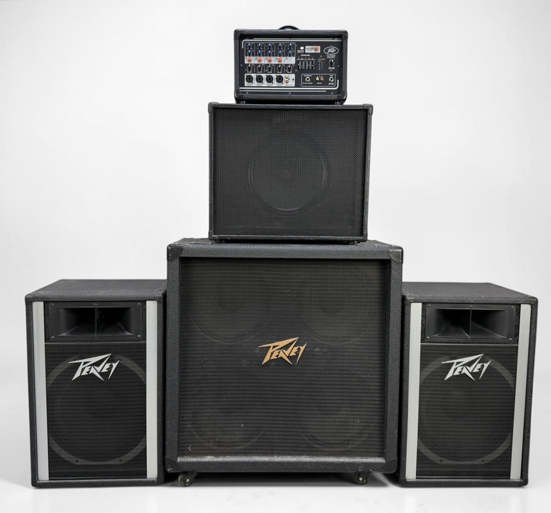 (4) Peavey Amps & (1) Mixer: Lot Includes: (1) PV 5300 Mixer (1) VYPYR Speaker (1) 412M Speaker (2) 115H Speakers Dimensions: 30" x 30" x 14" Largest Speaker Condition: The items are verified as