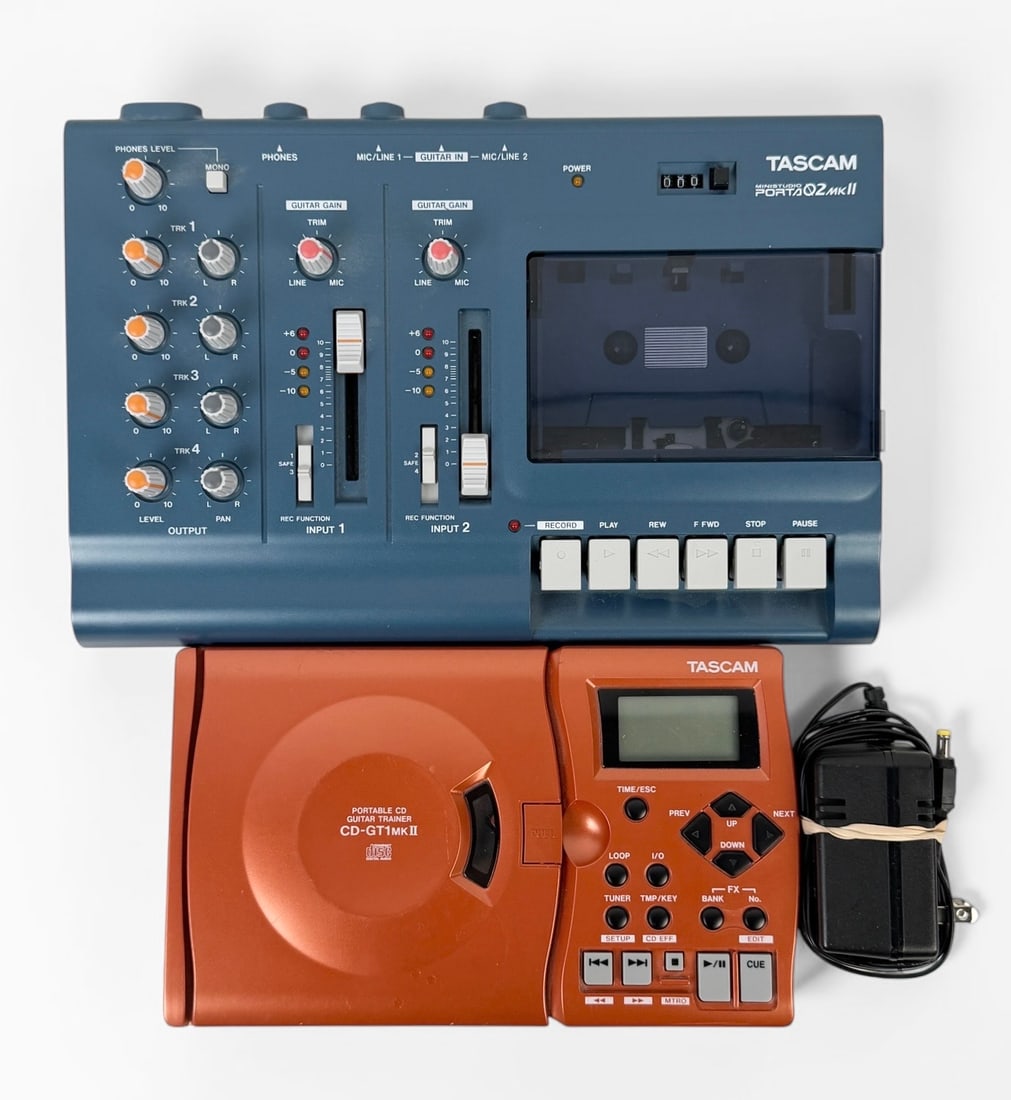 (2) TASCAM Audio Recorders: (1) TASCAM Porta02 Mkll Ministudio Cassette Recorder (1) TASCAM CD-GTmkll Portable CD Guitar Trainer Dimensions: 7 1/2" x 12" x 2 1/2" largest item Condition: