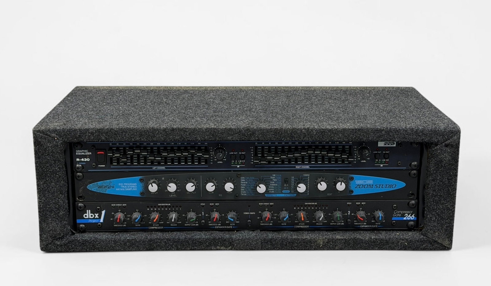DBX, Zoom Studio, & DOD Custom Audio Processor: Includes DOD R-430 Graphic Equalizer, 1202 Zoom Studio Stereo, and DBX Gate Compressor 266. Dimensions: 7" x 23" x 12 1/4" Condition: Surface marks and wear