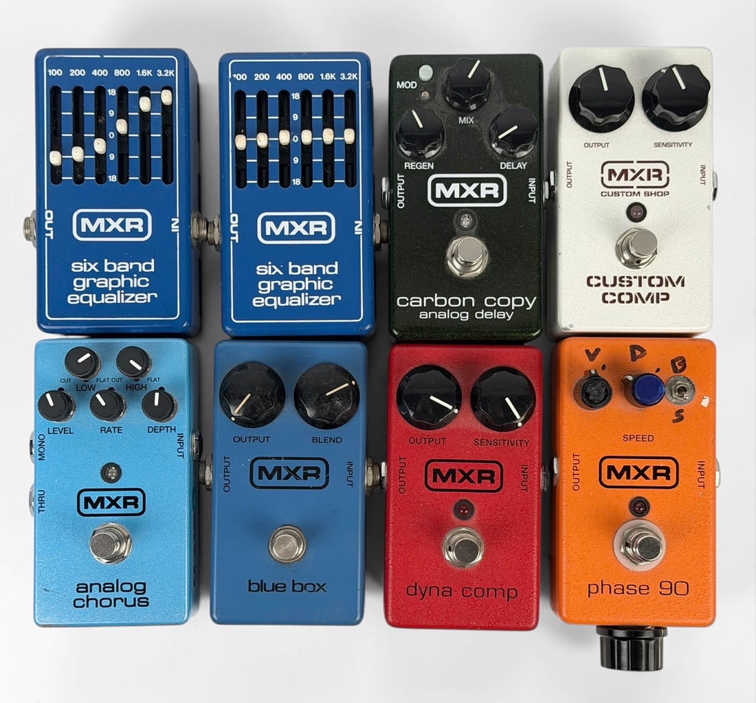 Group of MXR Guitar Pedals: Lot includes phase 90, carbon copy analog delay, custom comp, dyna comp m102, analog chorus m234, innovations blue box, (2) six band graphic equalizers Dimensions: 2 1/2" x 4 1/4" x