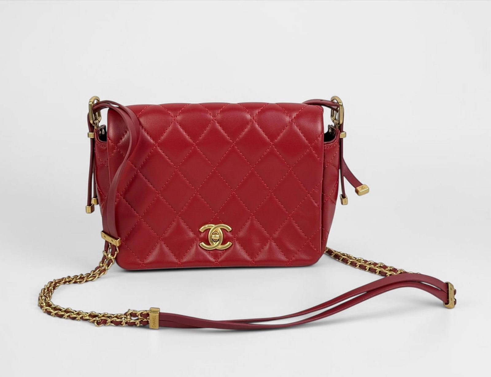 Chanel Red Quilted Lambskin Side Chain Mini Flap Bag with Box: Comes with original box, dustbags, and paperwork. Features gold-toned hardware and the iconic CC turnlock closure. One exterior pocket and two interior pockets. Dimensions: 6 
