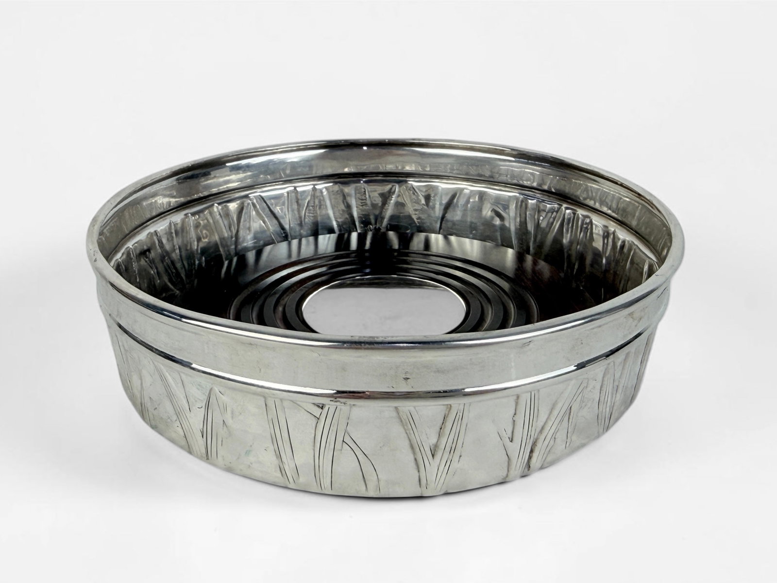 Tiffany & Co Sterling "Cattails" Wine Bottle Coaster: The wine bottle coaster features a wooden base and a green felted bottom. Total Weight: 9.45ozt including felt and wood elements. Dimensions: 1 1/2" x 5 1/2" Diameter