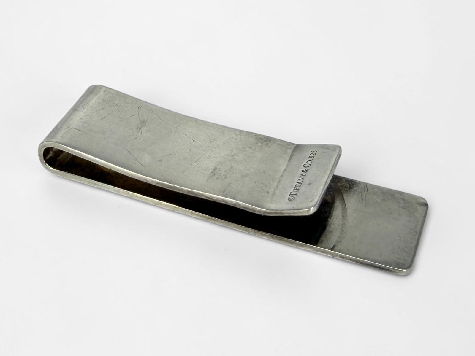 Tiffany & Co Sterling Silver Money Clip: Length: 2 1/4" Condition: Good with tarnishing and surface scratches consistent with use. No Box