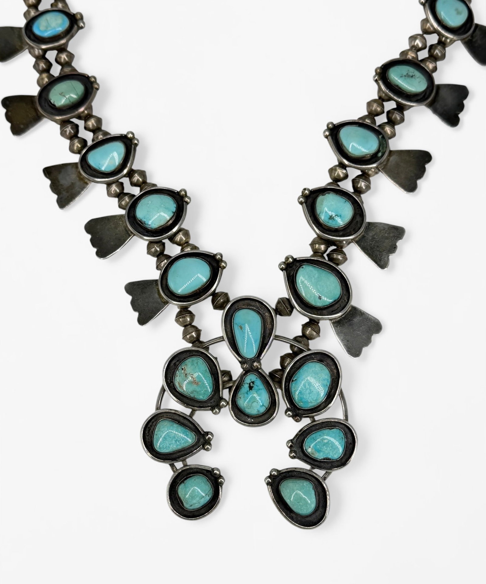 Vintage Silver & Turquoise Squash Blossom Necklace: Weight: 209.8g Length: 28" Long Pendant: 3 1/2" x 3" Condition: Some tarnishing to the silver; otherwise, the necklace is in good condition. 