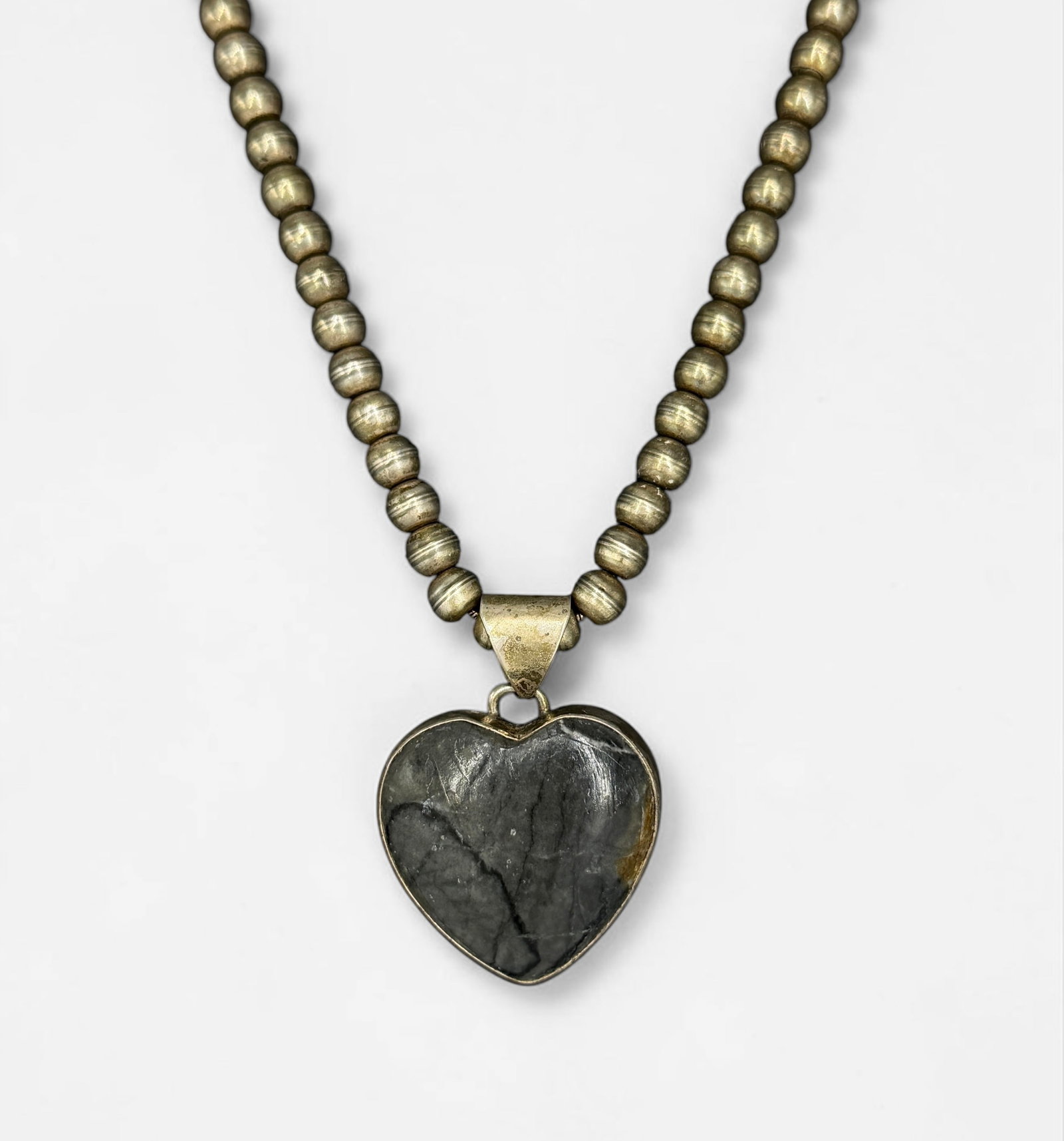 R.J. Apacheto Jasper Heart Pendant & Sterling Necklace: Weight: 30.75g Length: 18" Dimensions: 1 1/4" x 1" Condition: Tarnishing throughout; otherwise in good condition. 