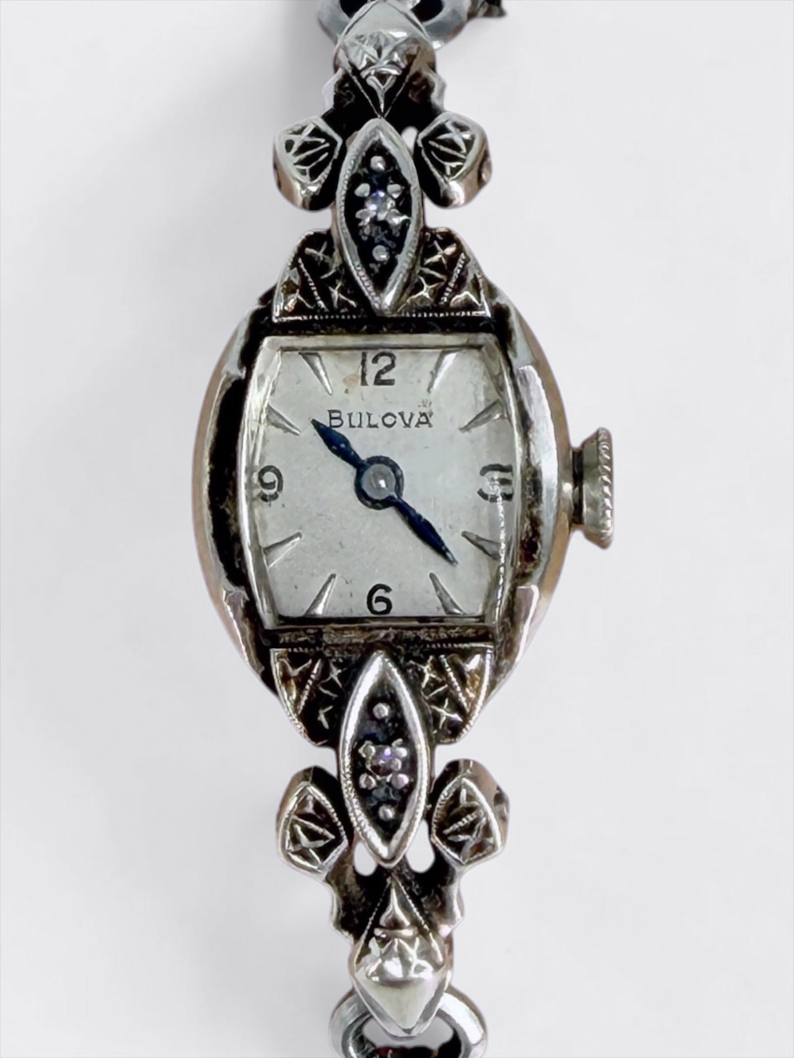 Ladies 14K White Gold Bulova Watch: Band not gold, adjustable Spidel band Condition: Not running