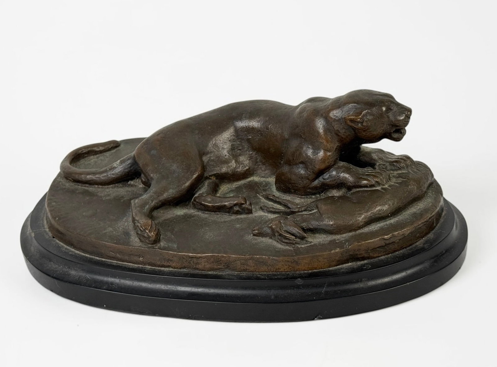 After Antoine-Louis Barye “Lion" Bronze Sculpture: Believed to be an after of Antoine-Louis Barye (1795-1875). Signed on the base. Dimensions: 3" x 5 1/2" x 9" Condition: The sculpture is in good condition.