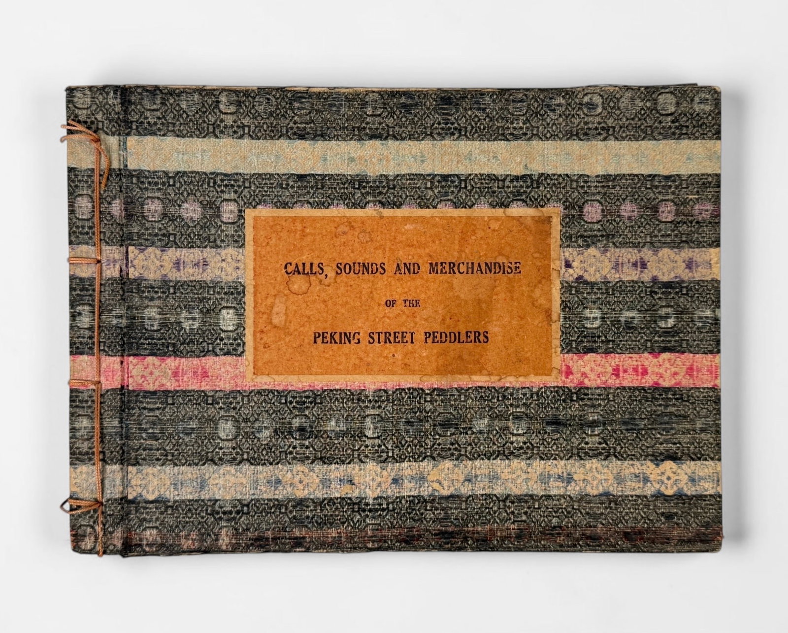 “Calls, Sounds and Merchandise of the Peking Street Peddlers" by Samuel Victor Constant: Published 1936. This work contains candid photographs, color illustrations of peddlers, and other elements to capture the sounds of street life in Peking. Dimensions: 7 1/2" x 10 1/2" x 1" Condition: 