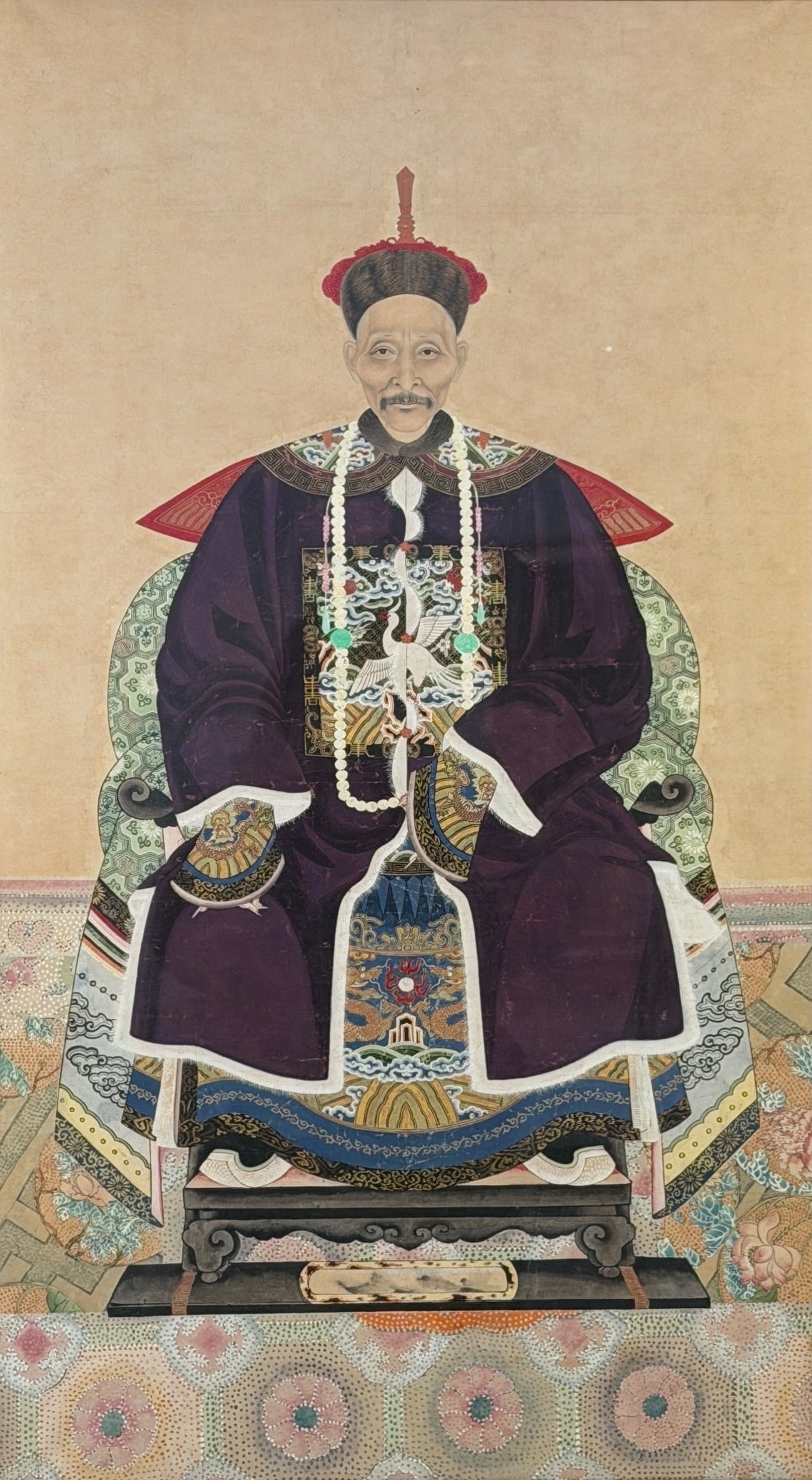 19th Century Chinese Ancestral Portrait: This ink on paper painting depicts a high-ranking court official as signified by his rank badge. Image: 35" x 19 1/2" Frame: 40" x 24 1/2" Condition: Fadi