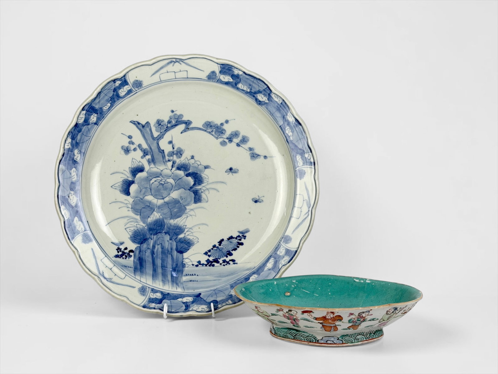 (2) Asian Porcelain Dishes: (1) 19th-century Chinese Famille Rose porcelain lobed footed bowl (1) 19th-century Japanese porcelain Imari charger plate Dimensions: 16 1/2" Diameter, Largest Piece Condition