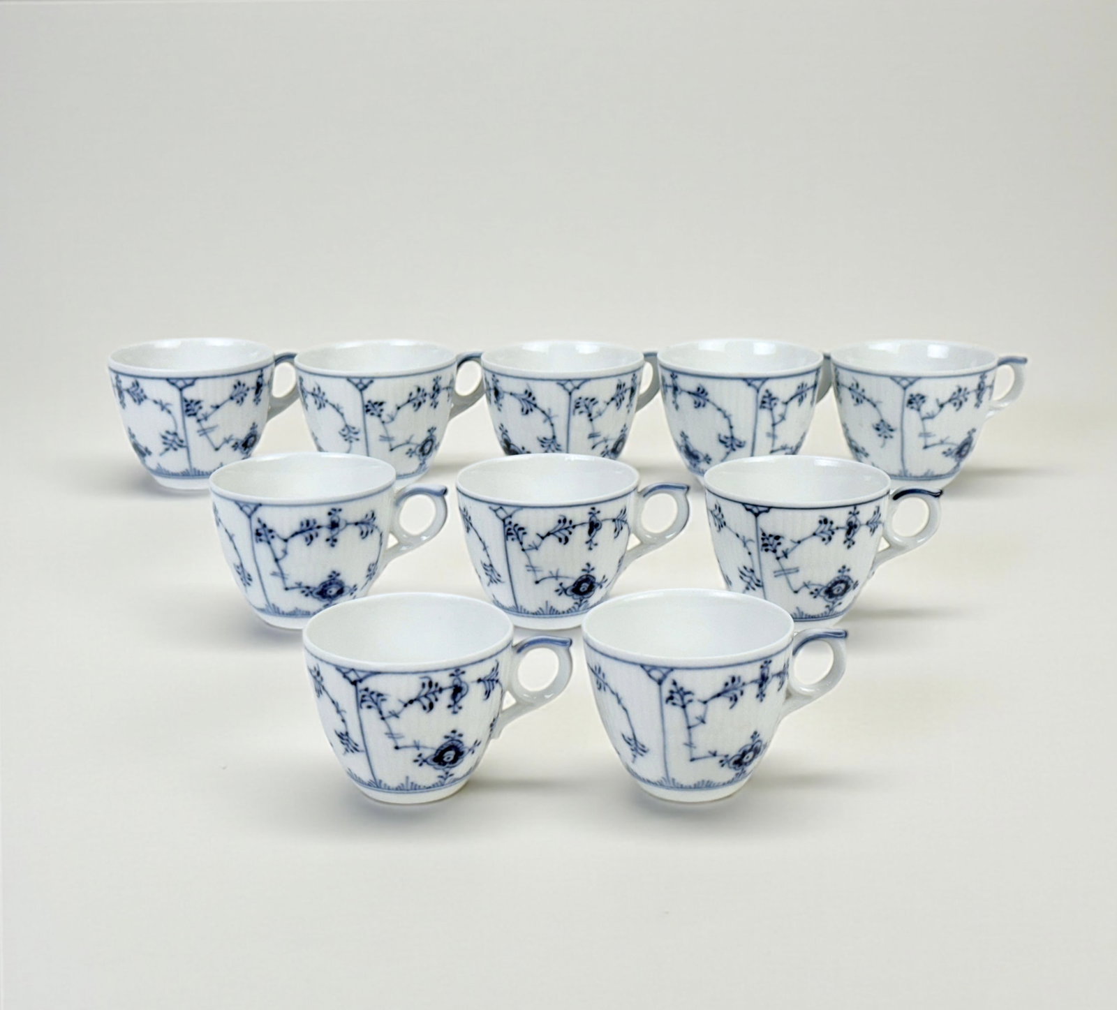 (10pc) Royal Copenhagen Blue Fluted Tea Cups: Dimensions: 2”T x 2 1/2” diameter Condition: Very good with minimal wear; no chips or cracks