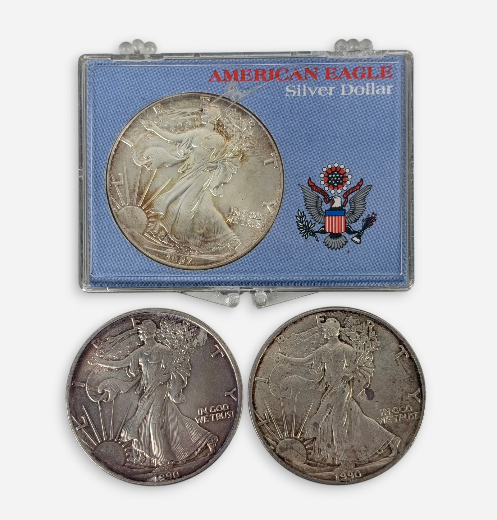 (3) 1oz Silver Eagles: One coin is in a case. Condition: See images for details. 
