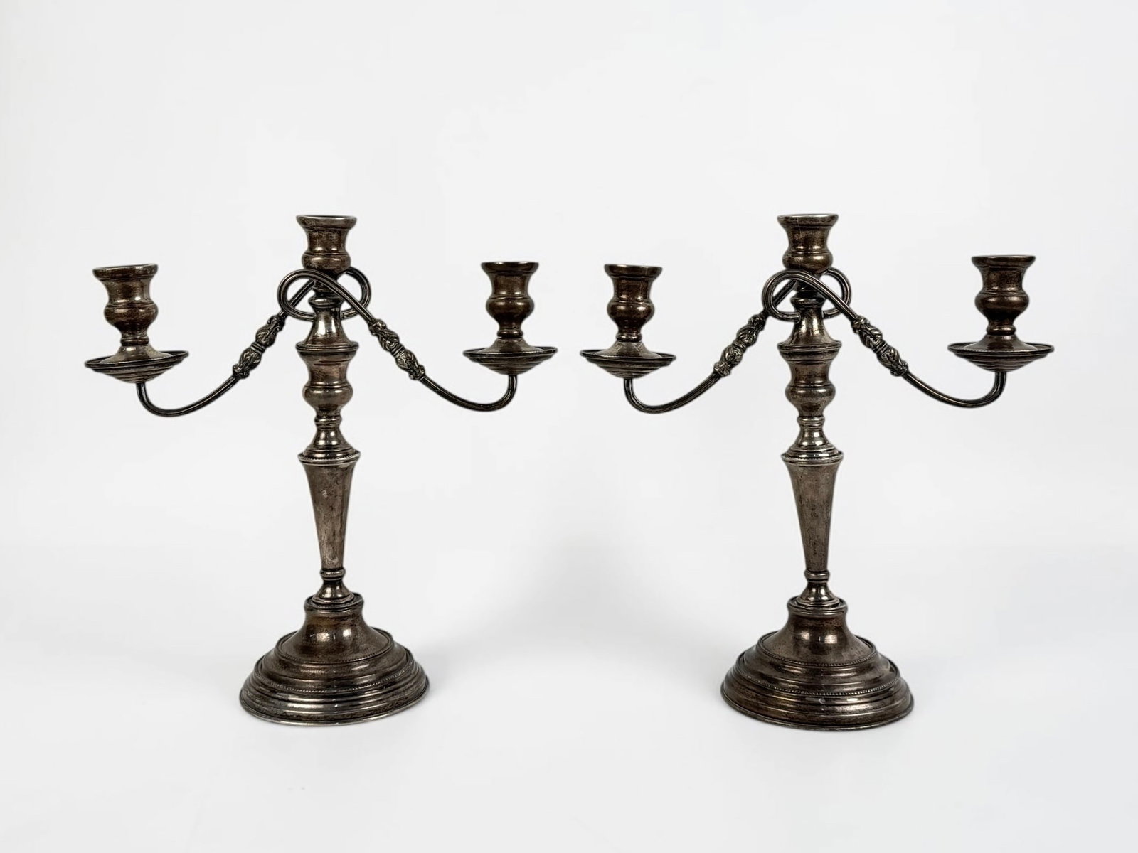 Mexican Solid Sterling Candelabras: Dimensions: 15" Tall x 14" Wide Total Weight: 113.94ozt Condition: Tarnishing and aging throughout. Otherwise, in good condition. No monograms. 