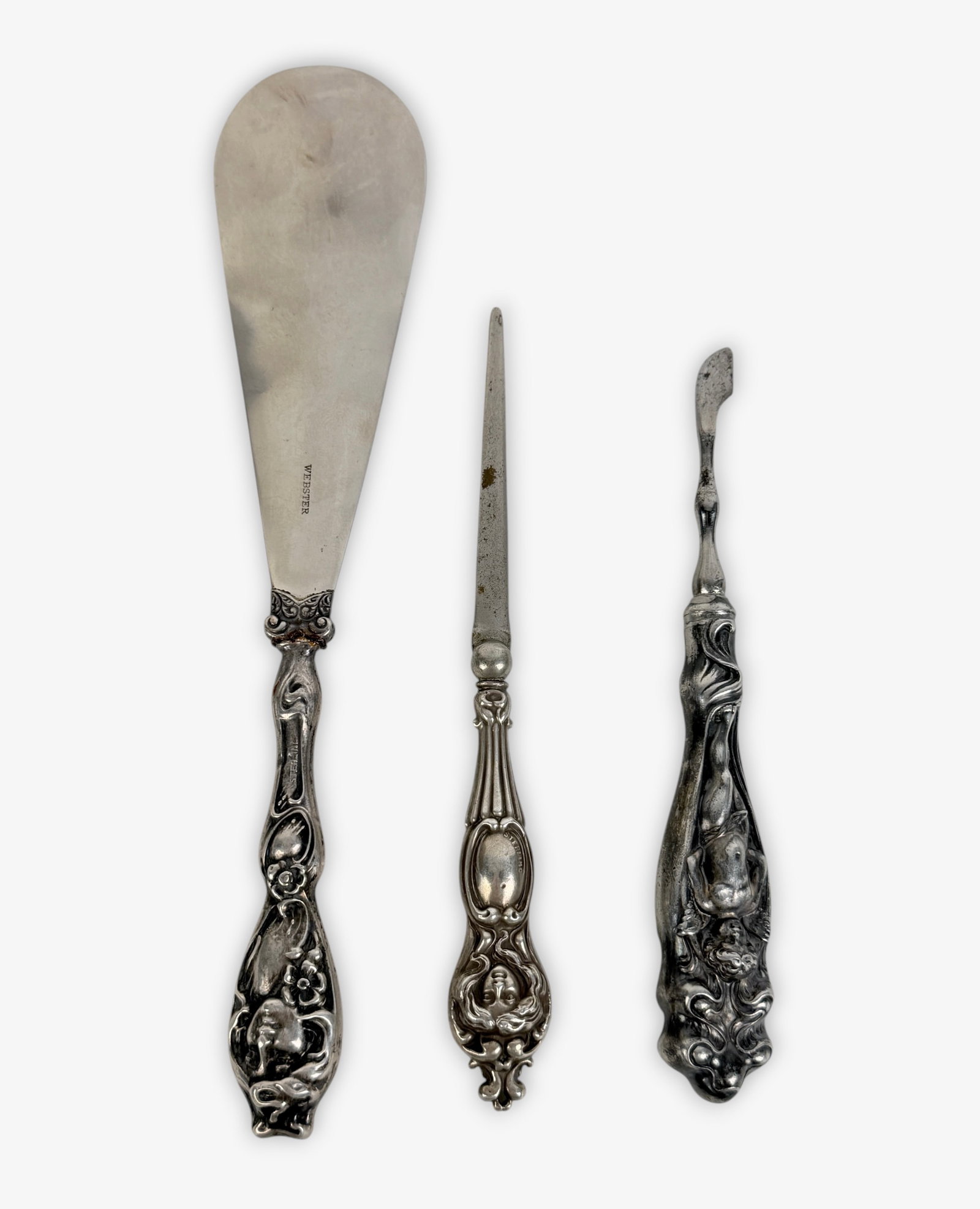 (3) Art Nouveau Sterling Handled Tools: Includes cuticle tool, small letter opener, and shoe horn Length Of Shoe Horn: 7 7/8" Condition: Good, no monograms. 