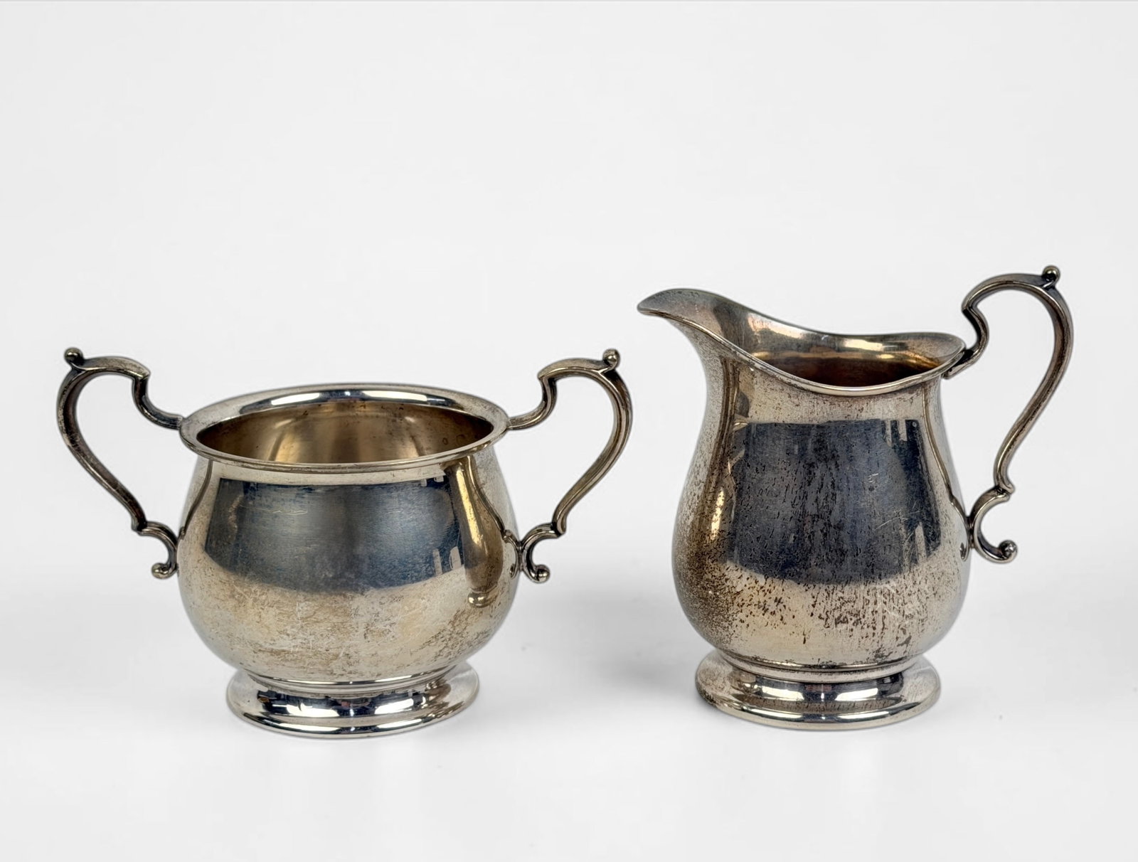 Vintage Fisher Sterling Cream & Sugar Dishes: Total Weight: 6.36ozt Dimensions: 3 1/2" Tall Cream Dish Condition: Minor tarnishing throughout, consistent with natural aging of silver. No monograms. 