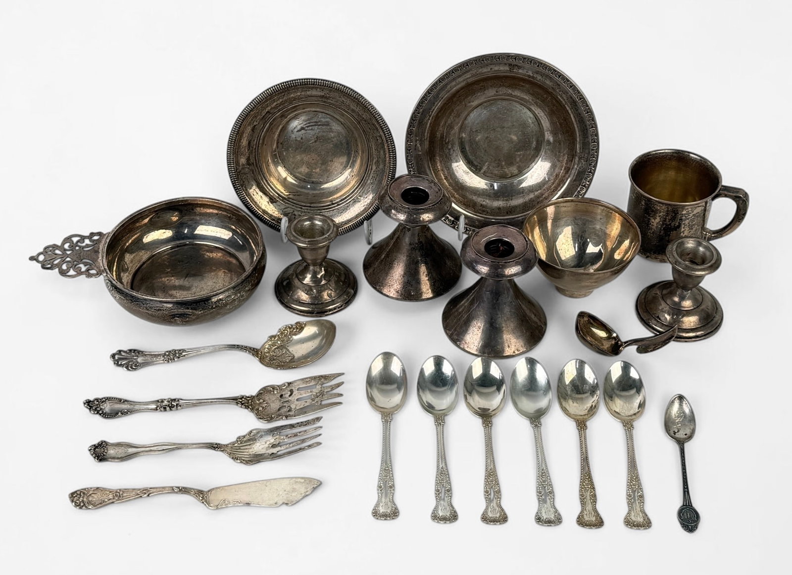 Group of Misc. Sterling Silver: Total Weight: 27.39 PLUS (4) Weighted Candlestick Holders Condition: Tarnishing throughout. The smaller pair of candelsticks has dents. See images for details. 