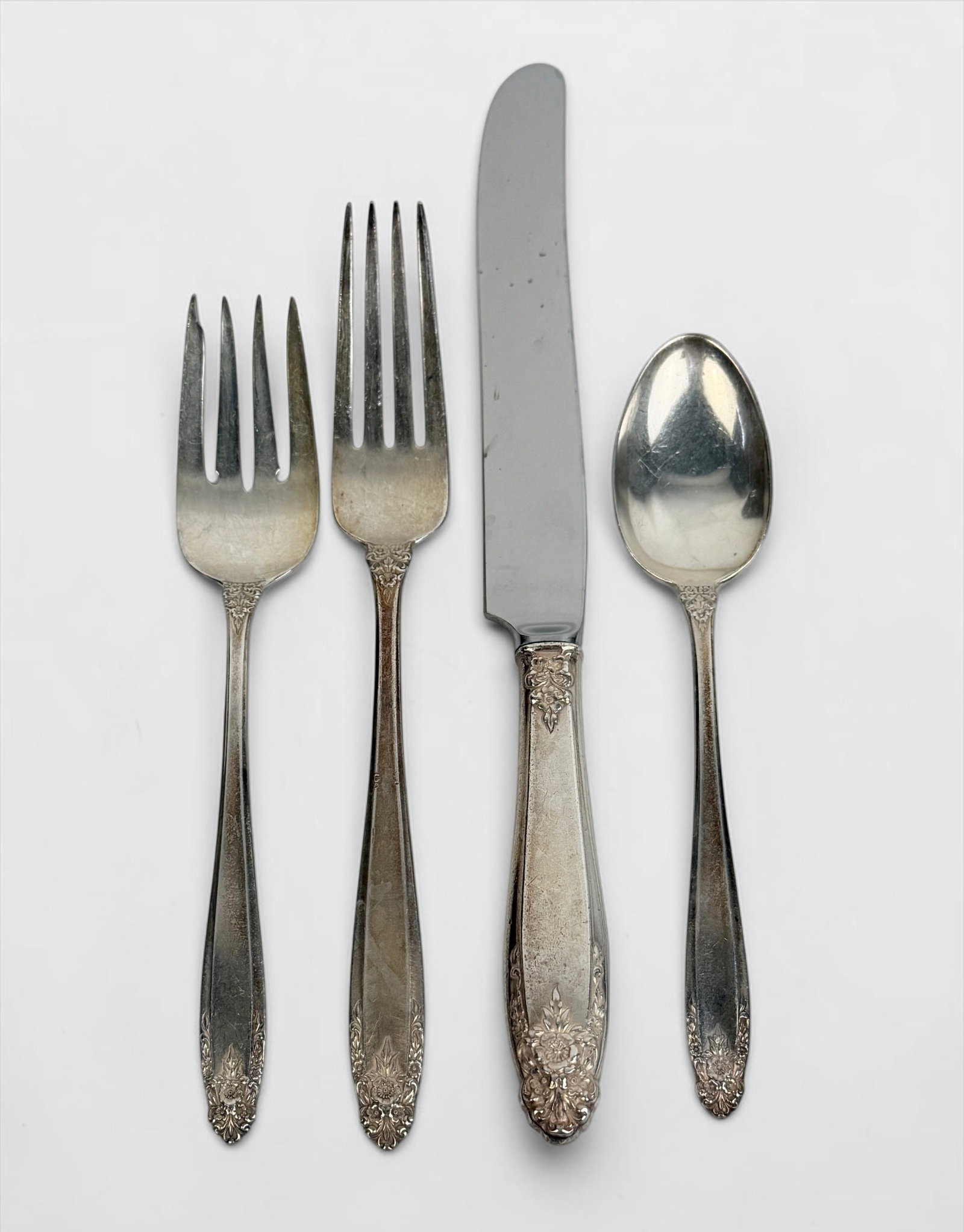 (57pc) Prelude Sterling Flatware Set: 7 Dinner Knives (9" Long) 8 Butter Knives (5 3/4" Long) 8 Dinner Forks (7" Long) 8 Salad Forks (6 1/2" Long) 17 Spoons (6" Long) 10 Serving Pieces (9" Longest) 
