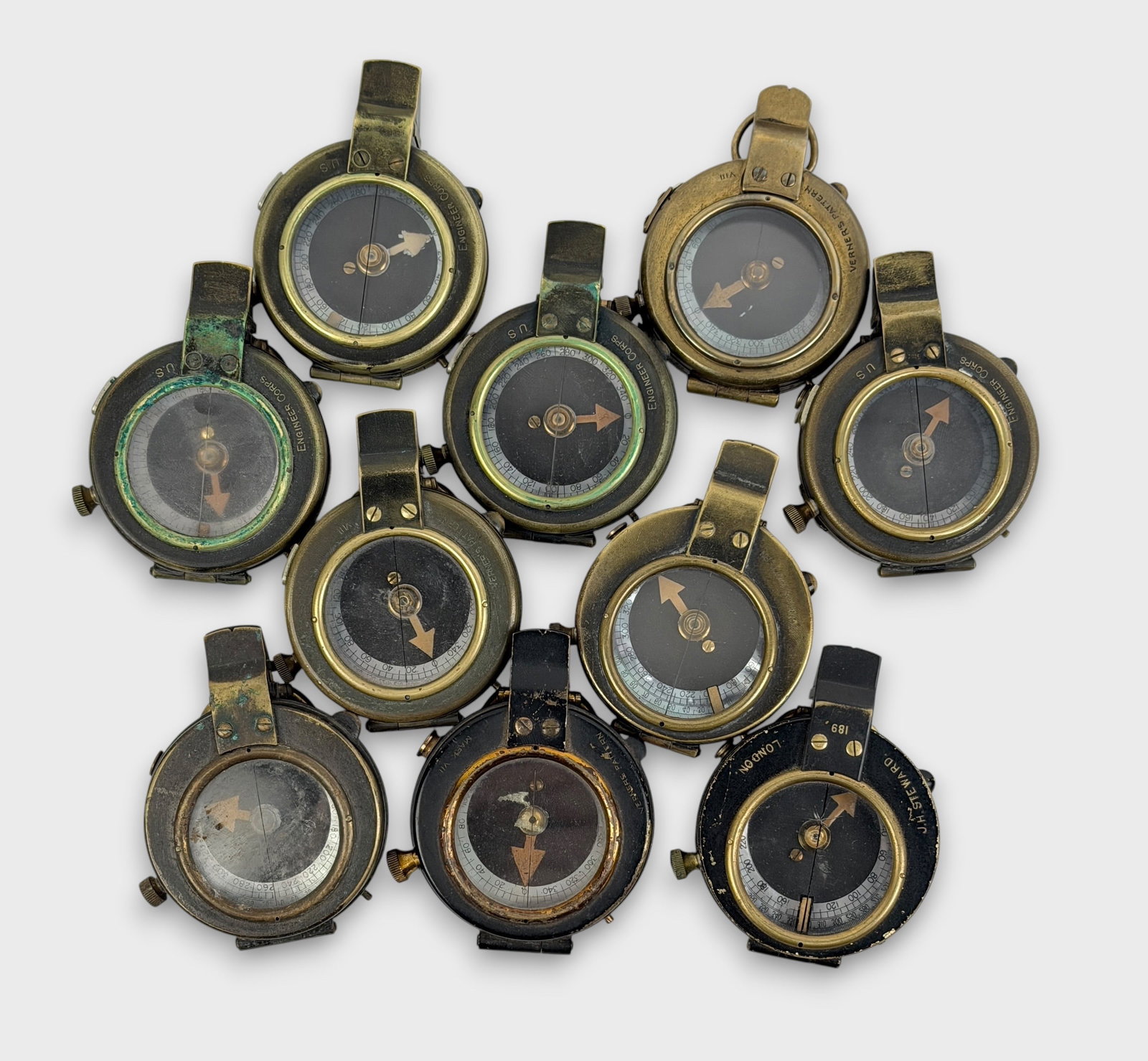 Group of (10) WWI Military Compasses (D): Size: 2" Diameter Condition: Mixed condition throughout with wear, tarnish, scratches, and scattered oxidation from age and use. Working but untested for accuracy. Please refer to the