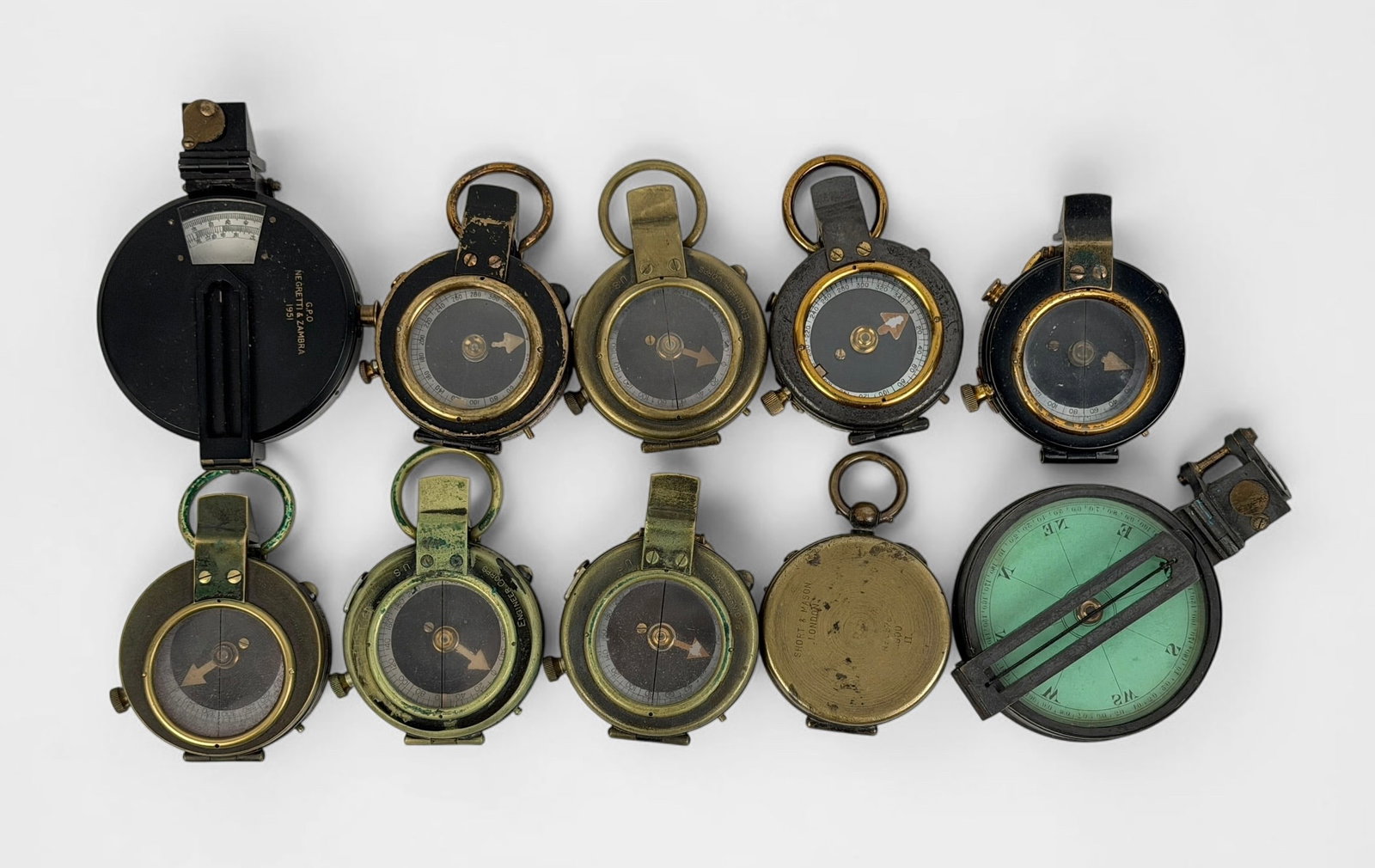 Group of (10) WWI Military Compasses (G): Size: 2" Diameter Condition: Mixed condition throughout with wear, tarnish, scratches, and scattered oxidation from age and use. Working but untested for accuracy. Please refer to the