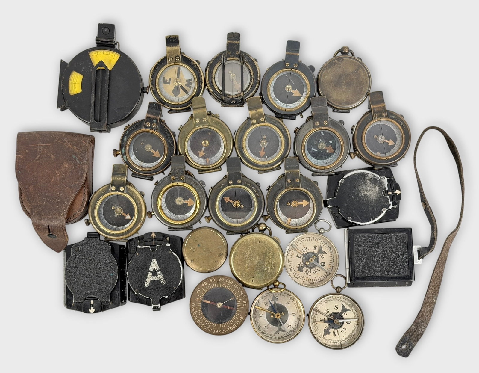 Group of (25) WWI Military Compasses (T): Size: 2" Diameter Condition: Mixed condition throughout with wear, tarnish, scratches, and scattered oxidation from age and use. Working but untested for accuracy. Please refer to the phot