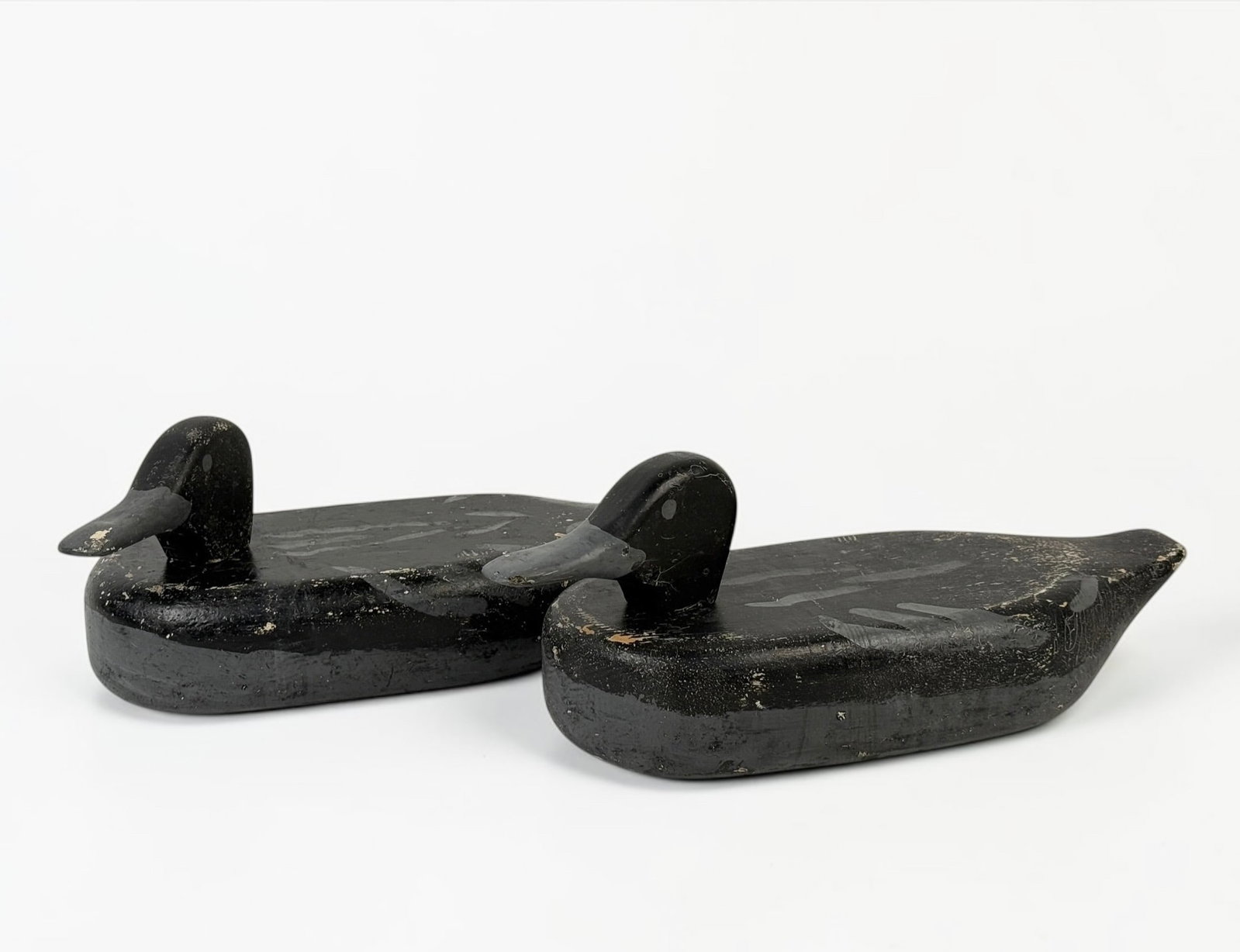 (2) Antique Compact Wooden Duck Decoys: Dimensions: 5" x 13" x 5" Condition: General wear throughout both decoys. See images for details. 