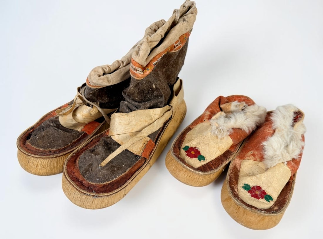 (2) Pairs of Native American Hard Sole Moccasins (E): Largest Pair: about 11" long Condition: There is wear and aging throughout both pairs of moccasins. The fur elements are deteriorating. There are signs of a past parasite infestation