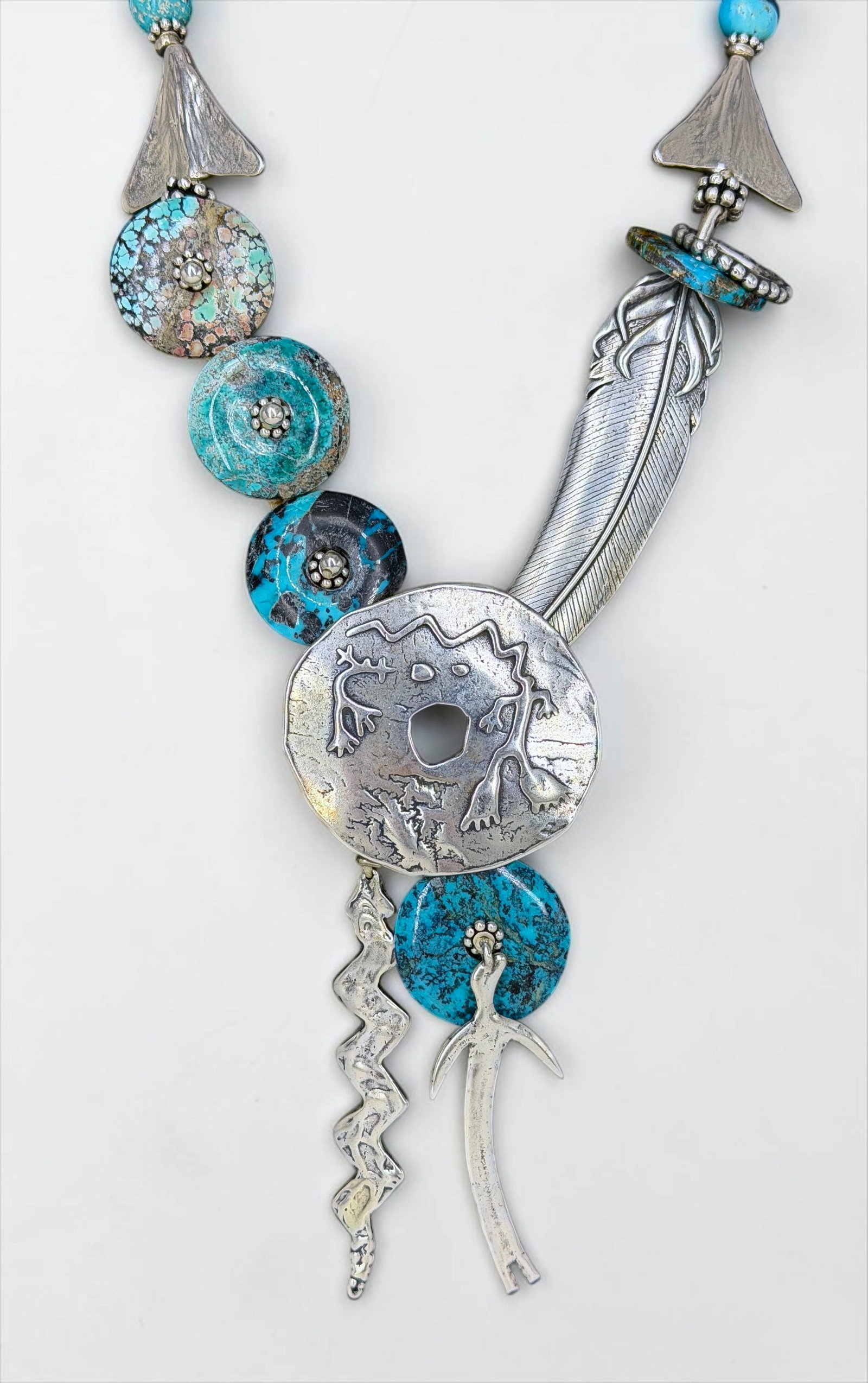 Mary & Doug Hancock Sterling Silver Turquoise Necklace: Stamped on a small pendant at the end of the chain. Length: 21" Pendant: 4" x 2" Condition: The necklace is in good condition. 