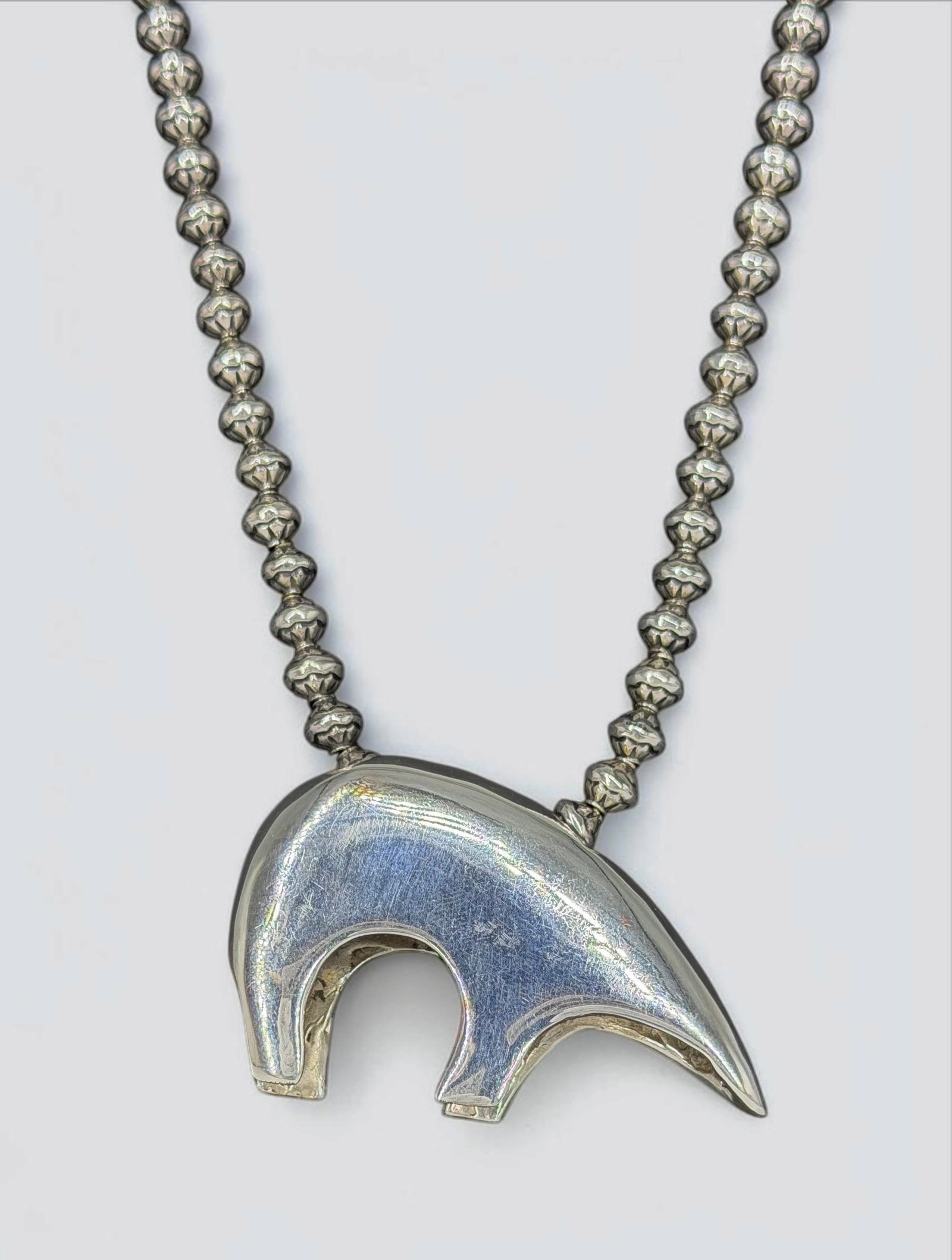 Zuni Silver Bear Pendant Necklace: Stamped illegibly on the interior. Total Weight: 86.9g Pendant Dimensions: 1 1/2" x 2 1/2" Length: 27" Condition: The necklace is in very good condition. 