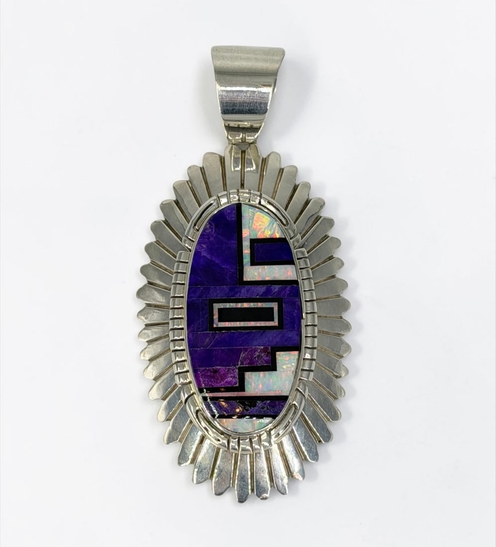 Randy Hoskie Navajo Sterling Silver, Sugilite, & Opal Pendant: Stamped on the reverse. Dimensions: 3 1/4" x 1 1/2" Total Weight: 39.48g Condition: The pendant is in very good condition. 
