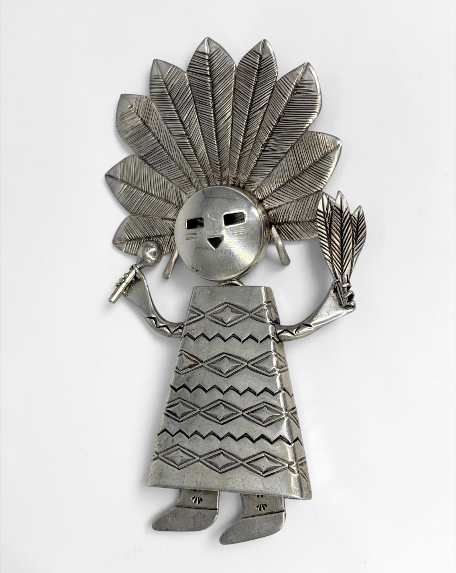 Navajo Sterling Silver Kachina Pendant: Stamped on the reverse. The piece can be either a pendant or a brooch. Dimensions: 5" x 2 1/2" Total Weight: 74.8g Condition: The pendant is in very good cond
