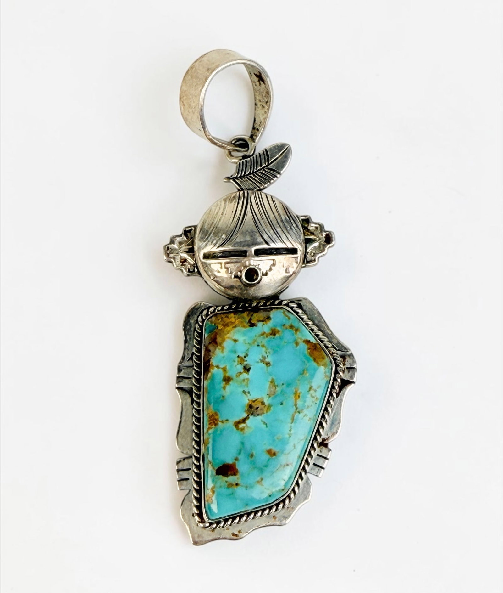 Navajo Sterling & Turquoise Kachina Pendant: Stamped with maker's mark on the reverse. Dimensions: 3" x 1" Total Weight: 18.7g Condition: The pendant is in good condition. See images for details. 