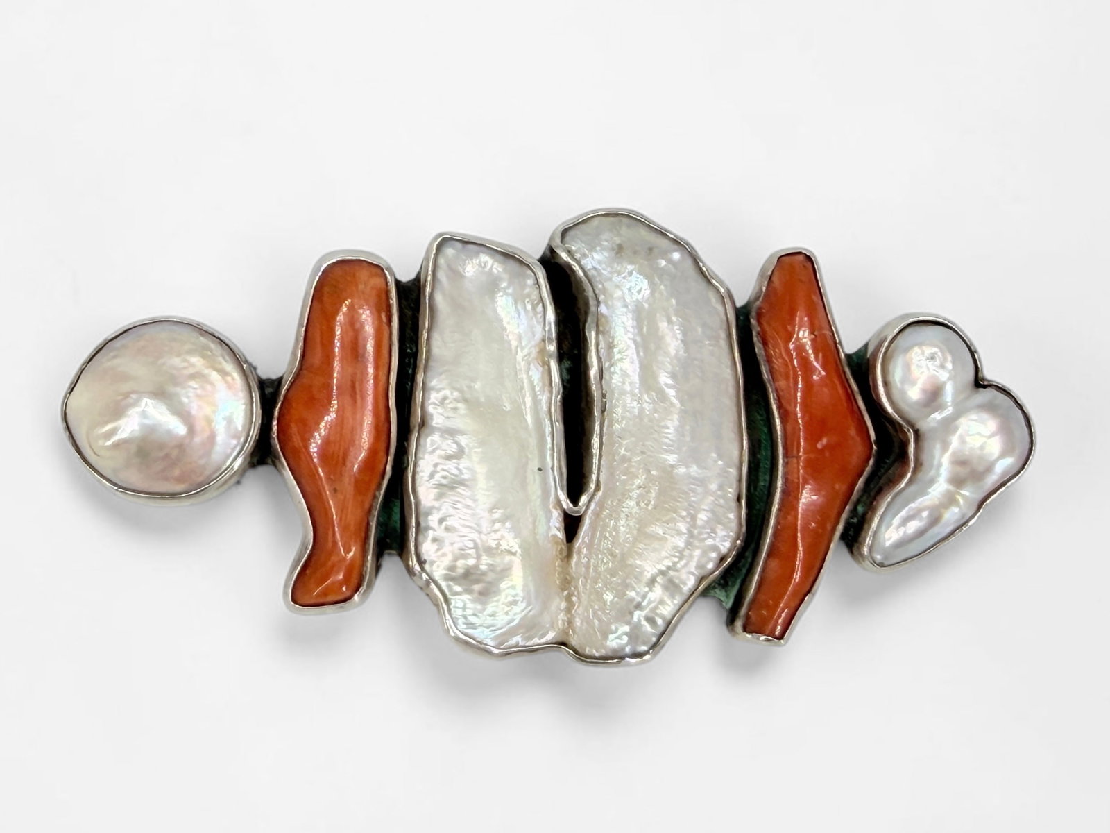 Mother of Pearl & Sterling Silver Brooch: Unknown maker's mark on the reverse. Dimensions: 3" x 1 1/4" Condition: In very good condition. 