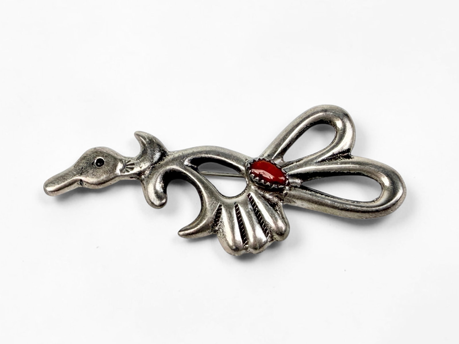 Vintage Navajo Road Runner Silver & Coral Pin: The pin is unsigned. Dimensions: 2 3/4" x 1 1/4" Total Weight: 13.6g Condition: Minor tarnishing throughout. Overall, the pin is in good condition. 