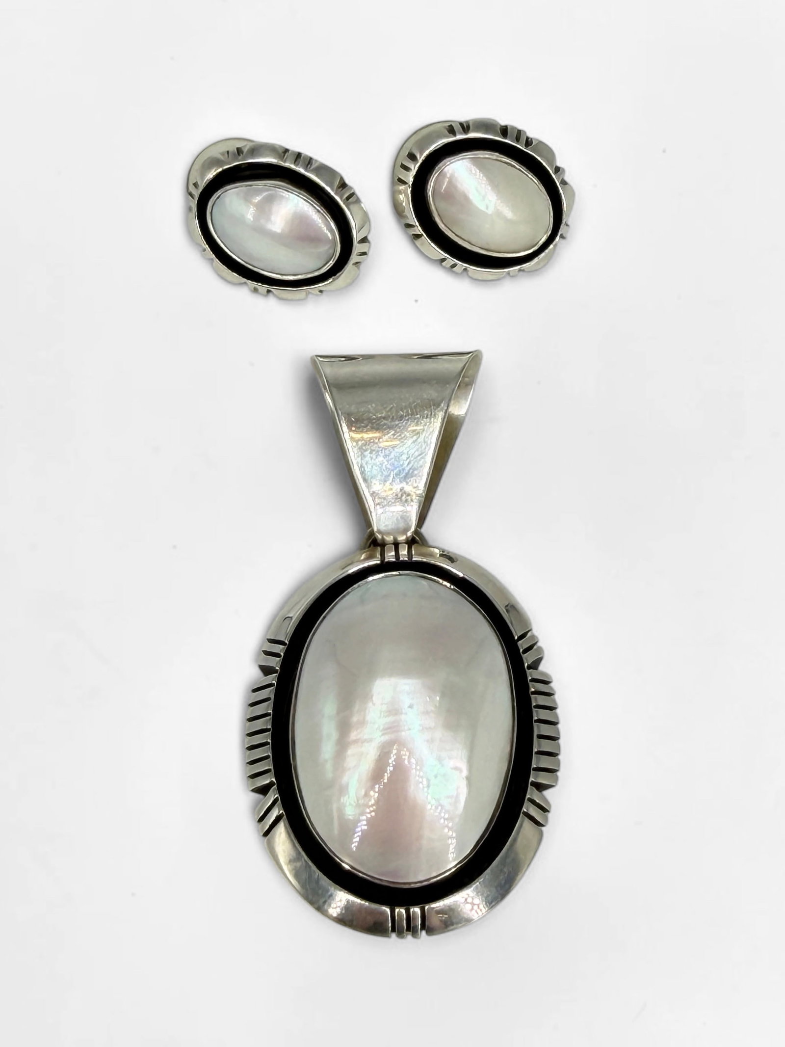 Carol Felley Sterling Silver & Mother of Pearl Earrings & Pendant: Signed on reverse. Dimensions of Pendant: 2 1/2" x 1 1/4" Condition: The set is in good condition. 