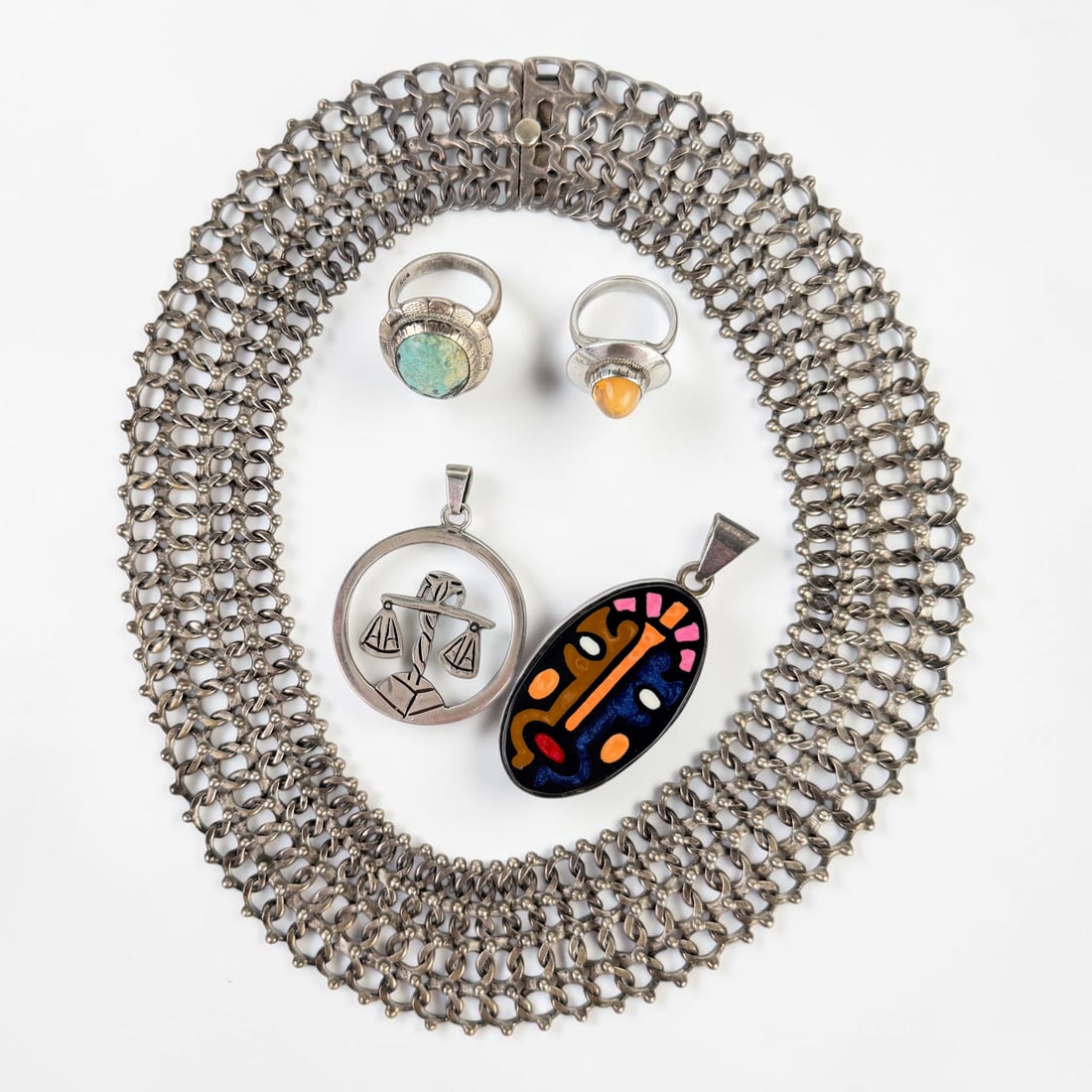 (5) Pieces of Sterling Jewelry: Lot includes (2) Rings, (2) Pendants, and (1) Necklace Necklace Length: 15 1/2" Long Total Weight: 121.7g Condition: Tarnishing throughout the jewelry. Otherwise, the pi