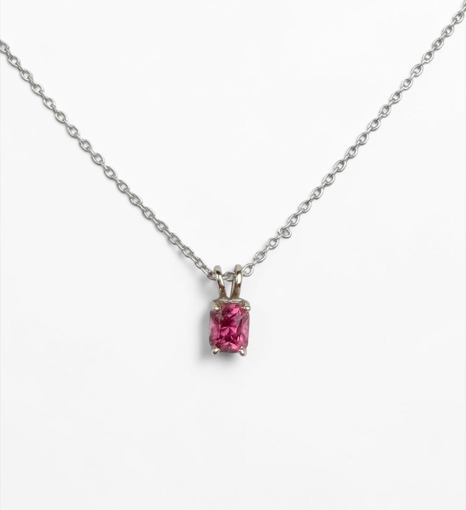 14K White Gold & Pink Tourmaline Necklace: Length: 18" Pendant: 9 mm x 4mm including bail. Total Weight: 2.4g Condition: The necklace is in good condition. Minor scratches to the frame of the pendant. 