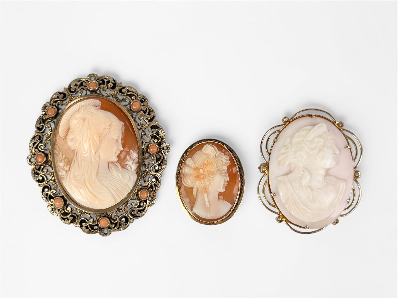 (3) Antique Cameo Pins (2) Gold & (1) .800 Silver: Dimensions of Largest: 1 3/4" Wide x 2" Tall Left: .800 Silver, Center: 18K Gold, Right: 14K Gold Total Weight: 29g Condition: The cameos are in good condition. Please see image