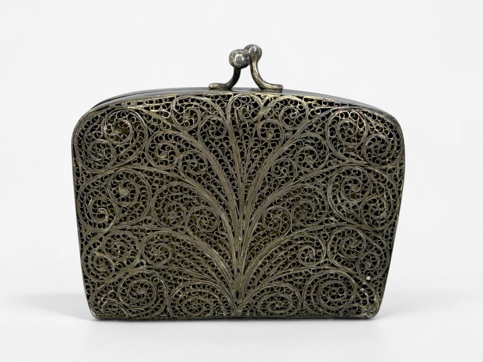 Antique Latvian .875 Silver Filigree Coin Purse: Dimensions: 2 1/2" x 2 3/4" x 1/2" when closed Total Weight: 2.23ozt Condition: Tarnishing to the silver exterior. Staining and wear to the interior fabric. 