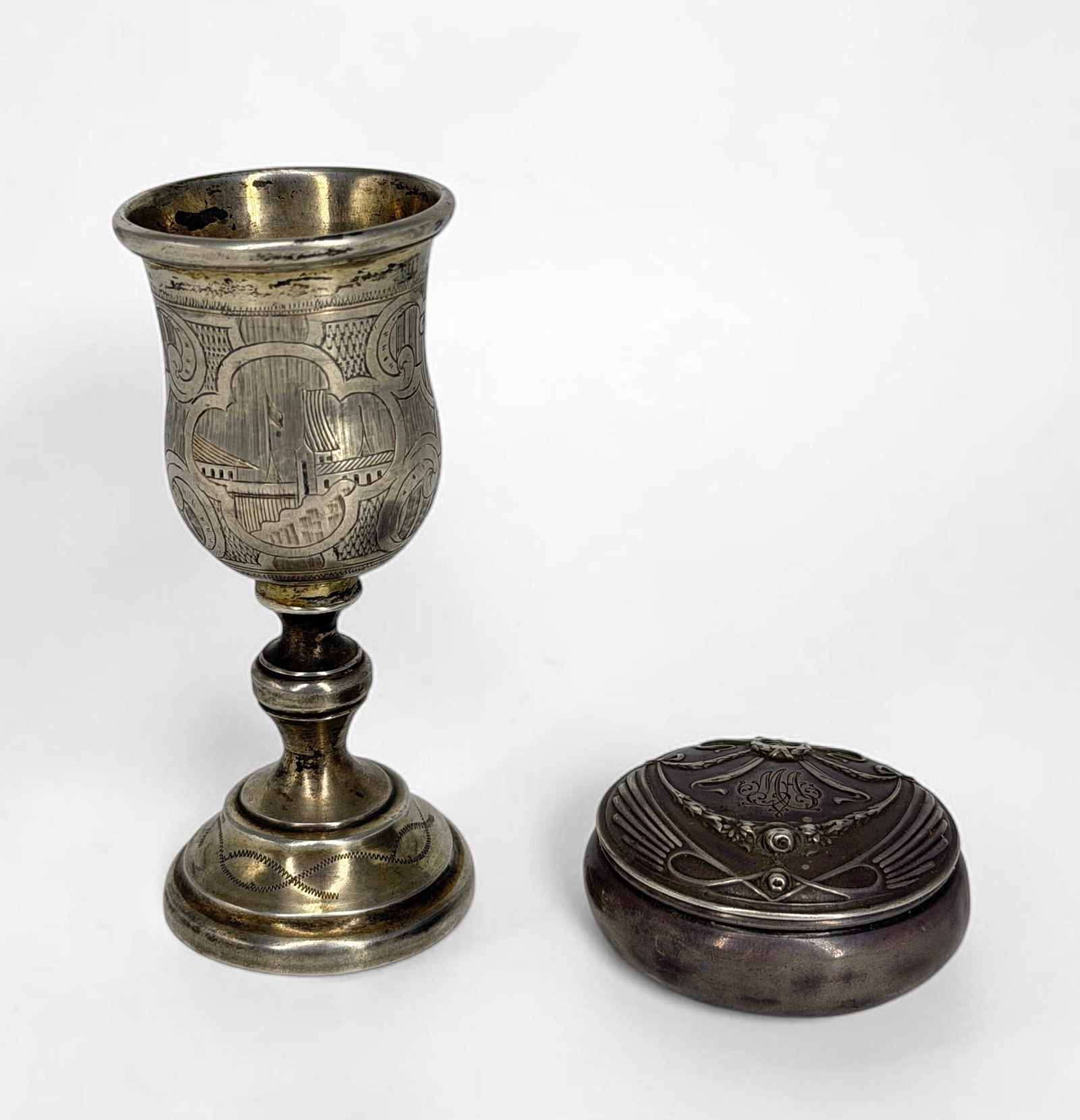 Russian .875 Silver Cordial Cup & Compact: Dimensions of Cup: 3 1/2" Tall x 1 1/2" Diameter Total Weight: 2.33ozt Condition: Tarnishing on both pieces. Bottom of the cup is warped, and the compact has small
