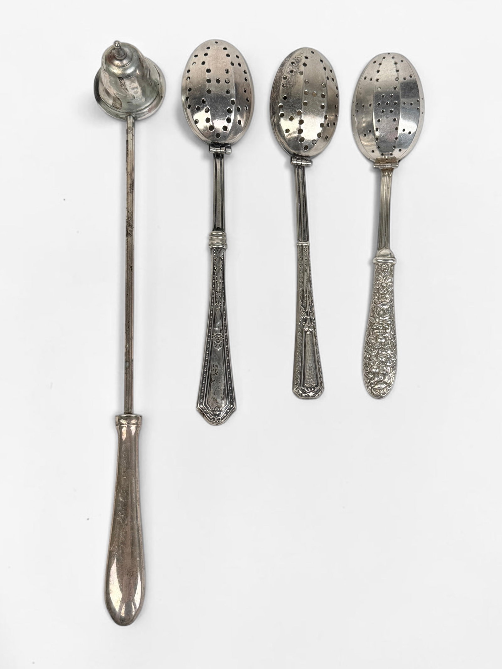 (3) Silver Tea Infusers & (1) Sterling Candle Snuffer: The tea infusers are sterling handled. Length of Candle Snuffer: 9 3/4" Weight of Snuffer: 1ozt Length of Tea Infuser: 6 1/2" Condition: There is tarnishing