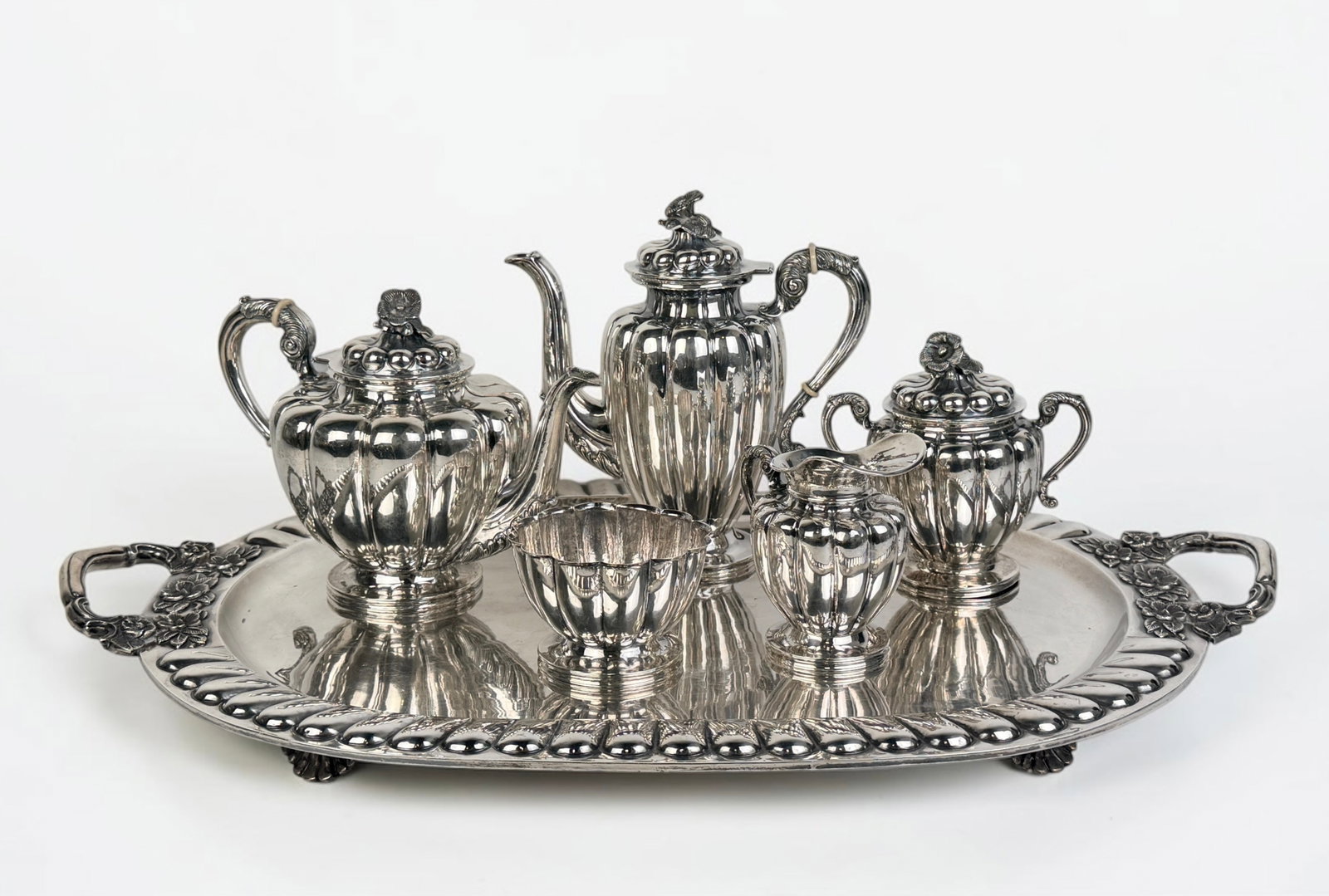 (6pc) Sanborns Sterling Silver Tea Set: Lot includes tray, tea pot, coffee pot, sugar dish, creamer, and waste bowl. Dimensions of Tray: 29" Long from Handle to Handle Total Weight: 203.3ozt including non silver