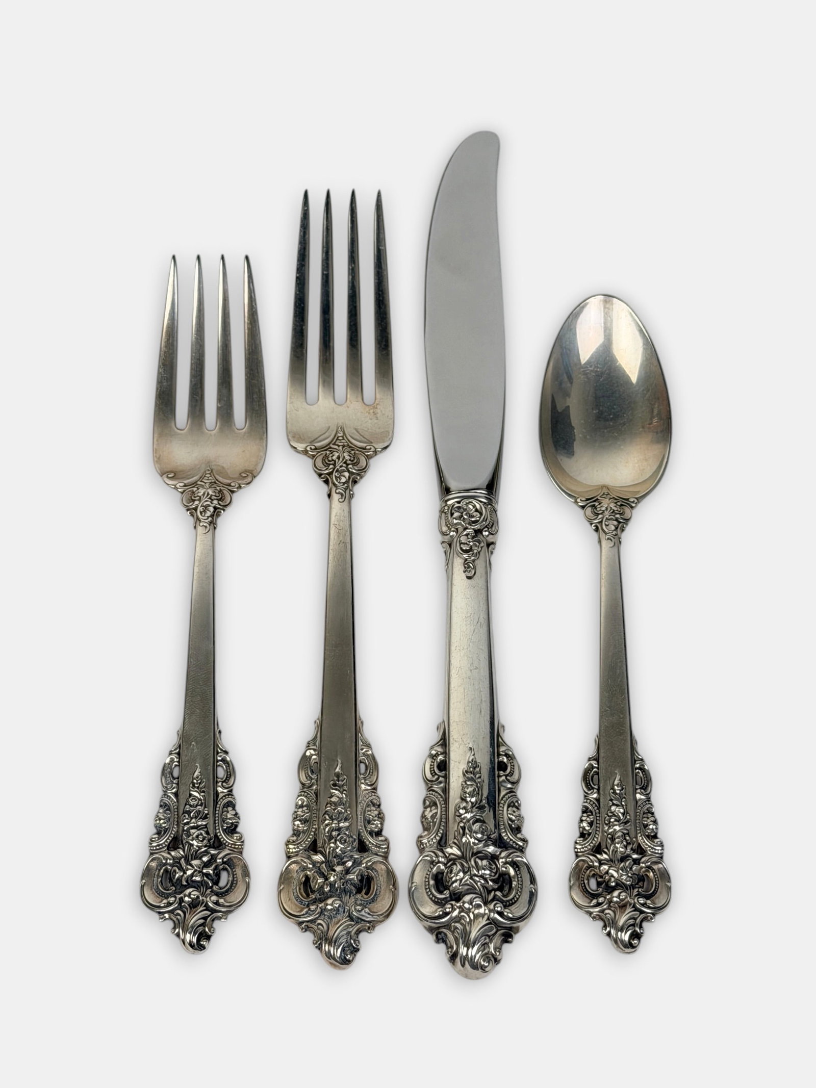 (78pc) Wallace "Grande Baroque" Sterling Flatware Set: Set Includes: 16 Dinner Knives (9" Long) 5 Butter Knives (6" Long) 16 Dinner Forks (7 1/2" Long) 16 Dessert Forks (6 1/2" Long) 16 Spoons (6" Long) 9 Serving Utensils (13" Longest Piece - Bread