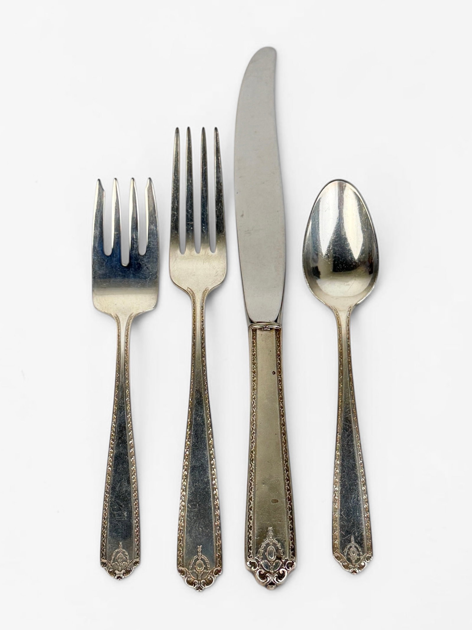 (52pc) Westmorland "Lady Hilton" Sterling Flatware Set: Set Includes: 11 Dinner Knives (9" Long) 11 Dinner Forks (7 1/4" Long) 11 Salad Forks (6" Long) 4 Soup Spoons (6" Long) 14 Spoons (6" Long) 1 Serving Spoon (8" Long) Total Weight: 46.6ozt PLUS (11