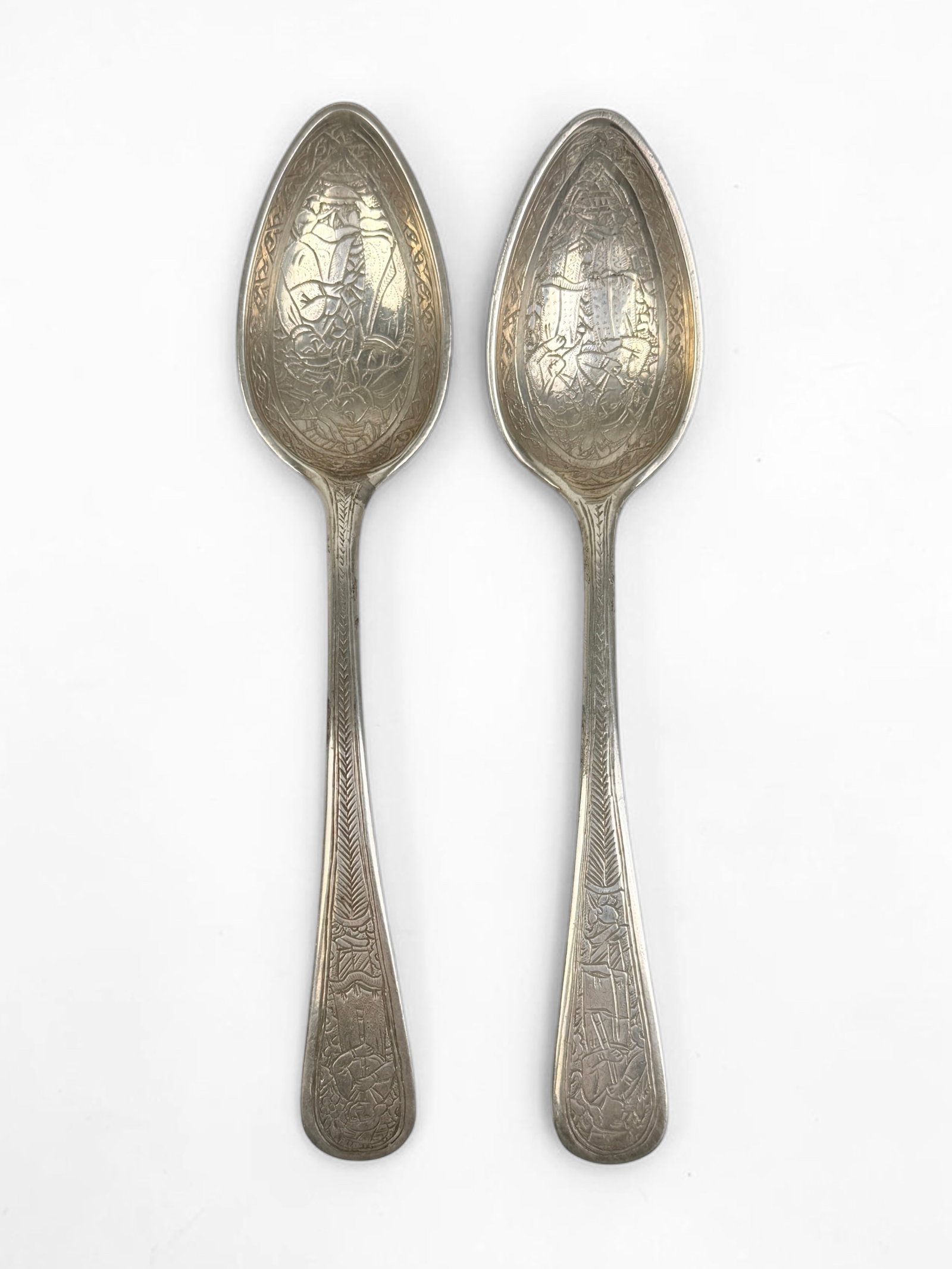(2) Hand-Engraved .900 Silver Spoons: Length: 6" Total Weight: 2.1ozt Condition: Both spoons are in very good condition. 