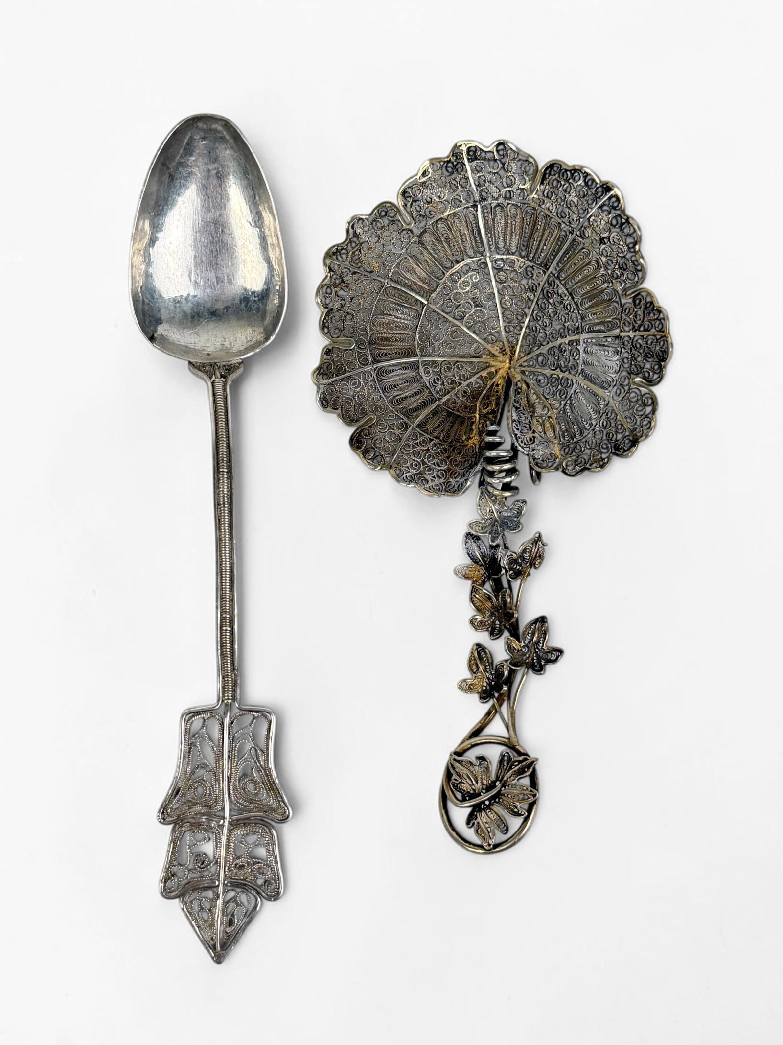 (2) Handmade European Silver Filigree Spoons: Length: 6" longest spoon Total Weight: 0.99ozt Condition: Both spoons are tarnished, but are in good condition. No monograms. 